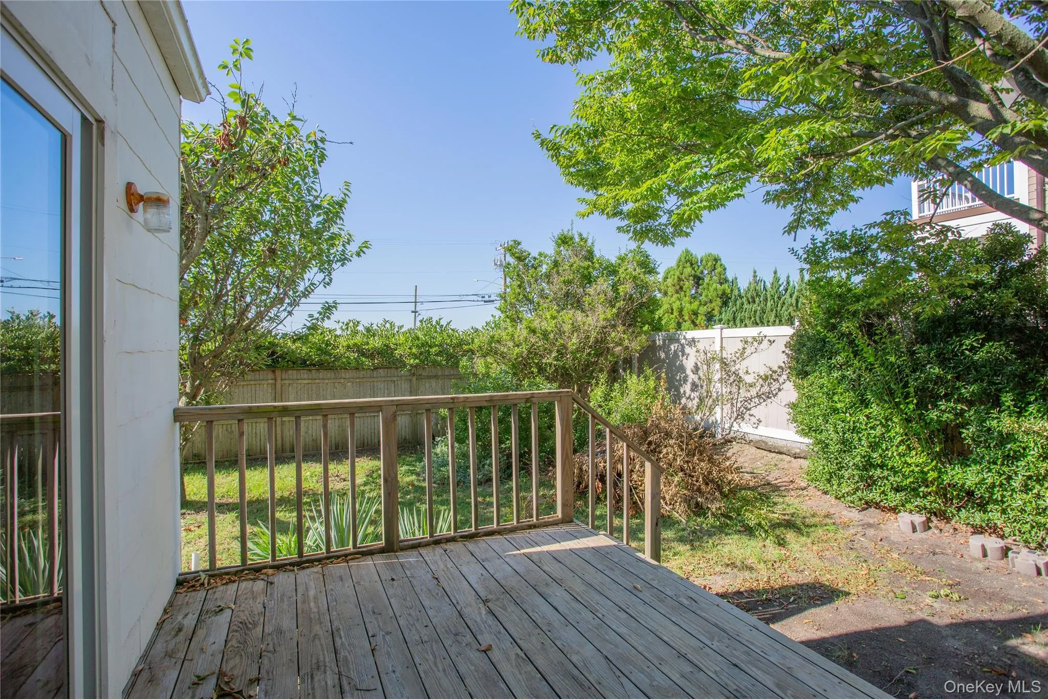 Deck with a fenced backyard Deck with a fenced backyard