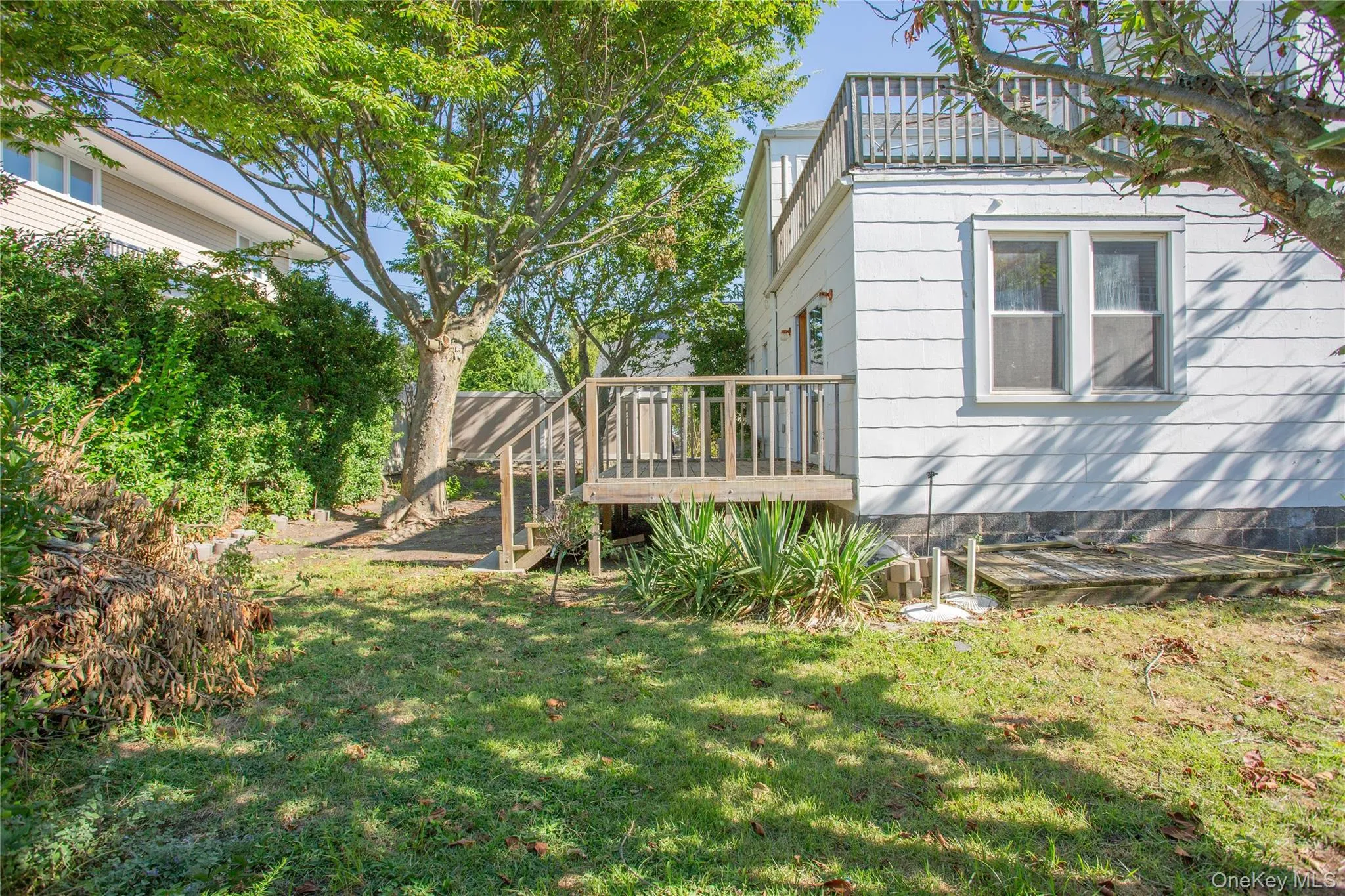 View of yard featuring a wooden deck View of yard featuring a wooden deck