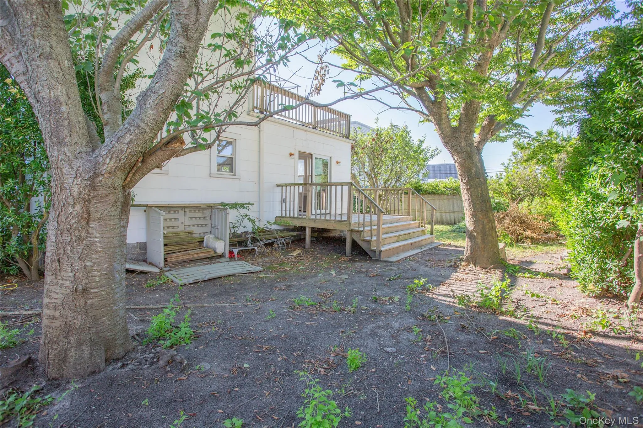Back of property featuring a wooden deck Back of property featuring a wooden deck