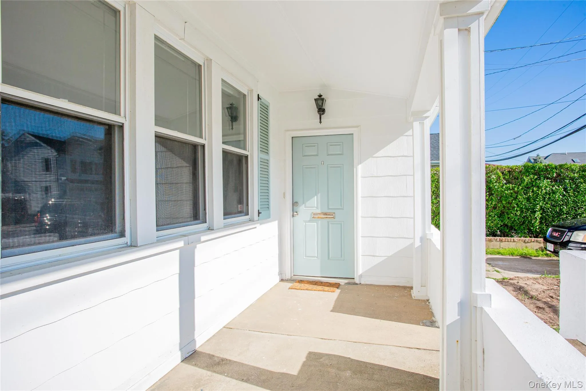 Doorway to property featuring a porch Doorway to property featuring a porch