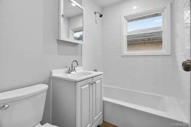 Bathroom featuring shower / washtub combination and vanity Bathroom featuring shower / washtub combination and vanity