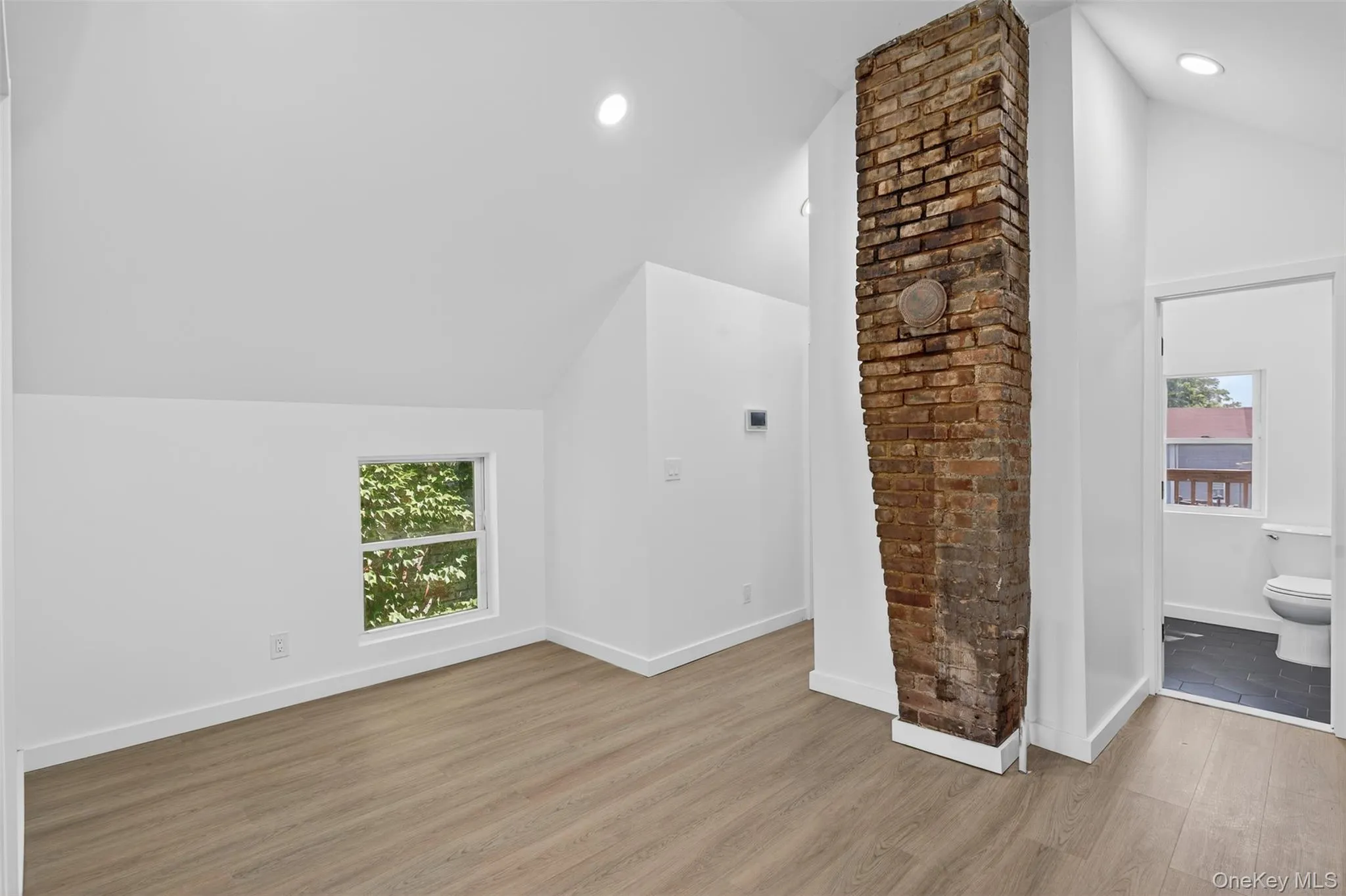Bonus room with vaulted ceiling, wood finished floors, and recessed lighting Bonus room with vaulted ceiling, wood finished floors, and recessed lighting
