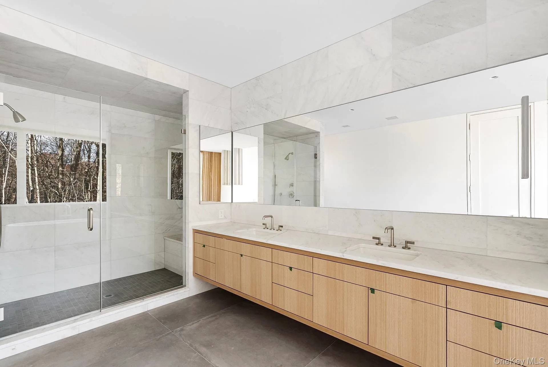 Full bathroom featuring double vanity and a stall shower Full bathroom featuring double vanity and a stall shower
