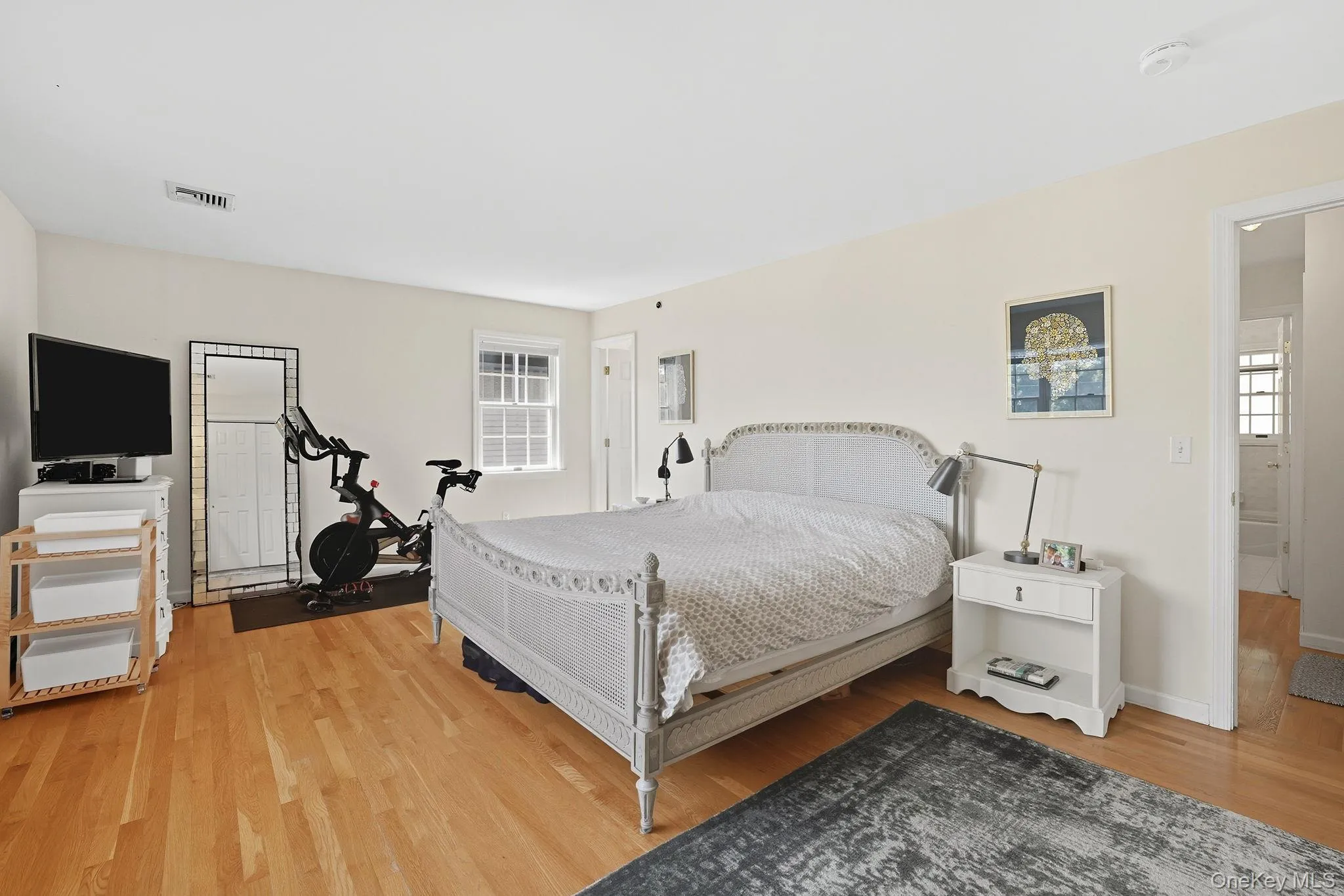 Featuring hardwood floors, his and her\'s closets, and ensuite bathroom Featuring hardwood floors, his and her\'s closets, and ensuite bathroom
