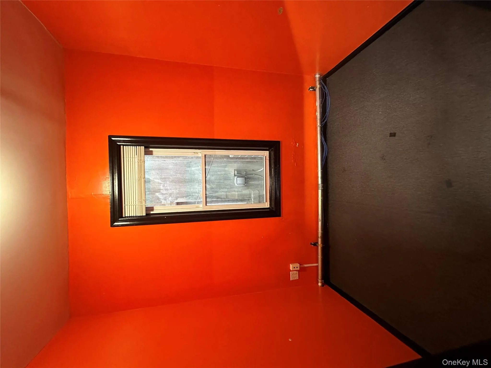 Carpeted spare room featuring baseboards Carpeted spare room featuring baseboards