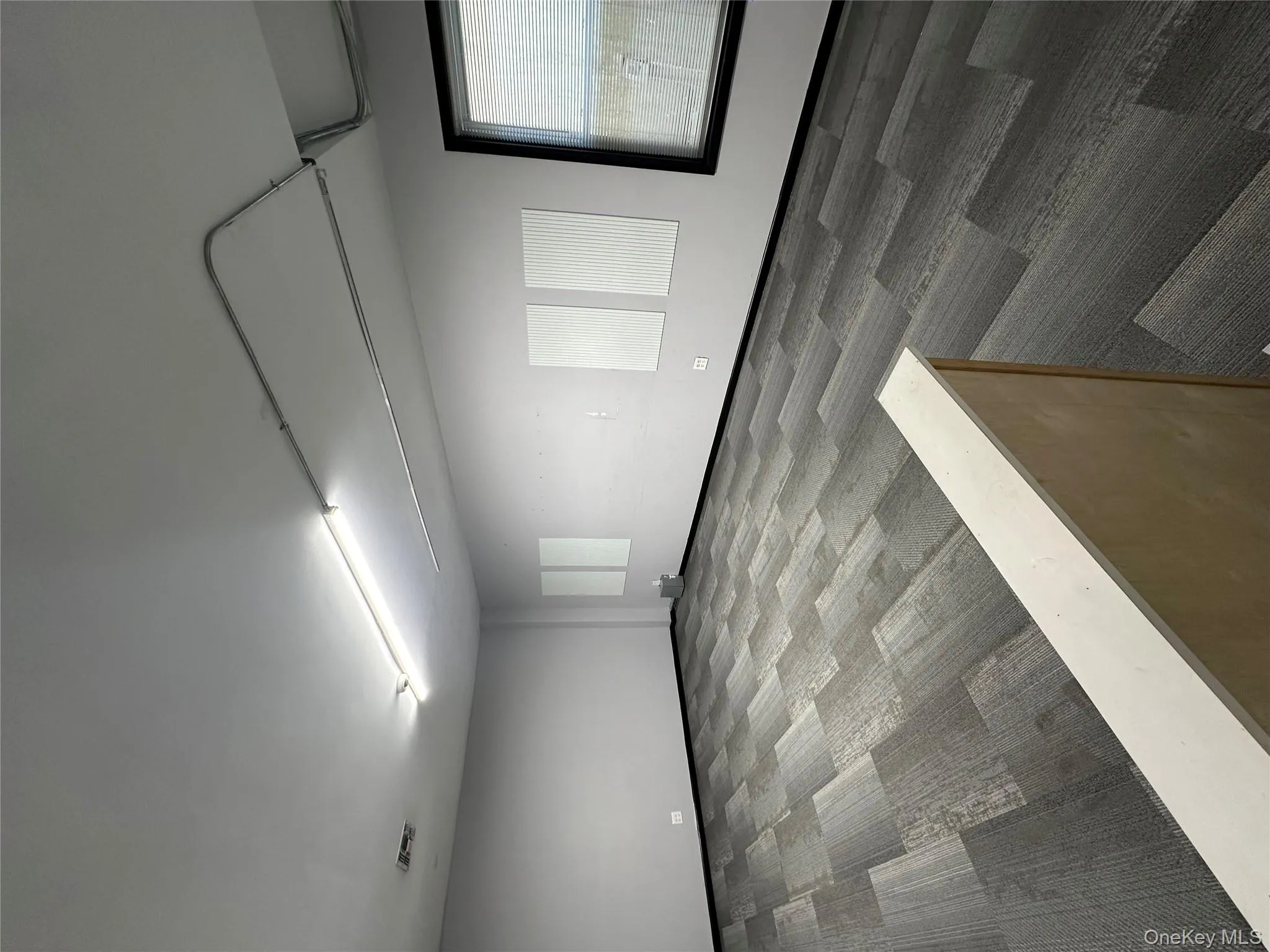 Empty room featuring carpet flooring Empty room featuring carpet flooring