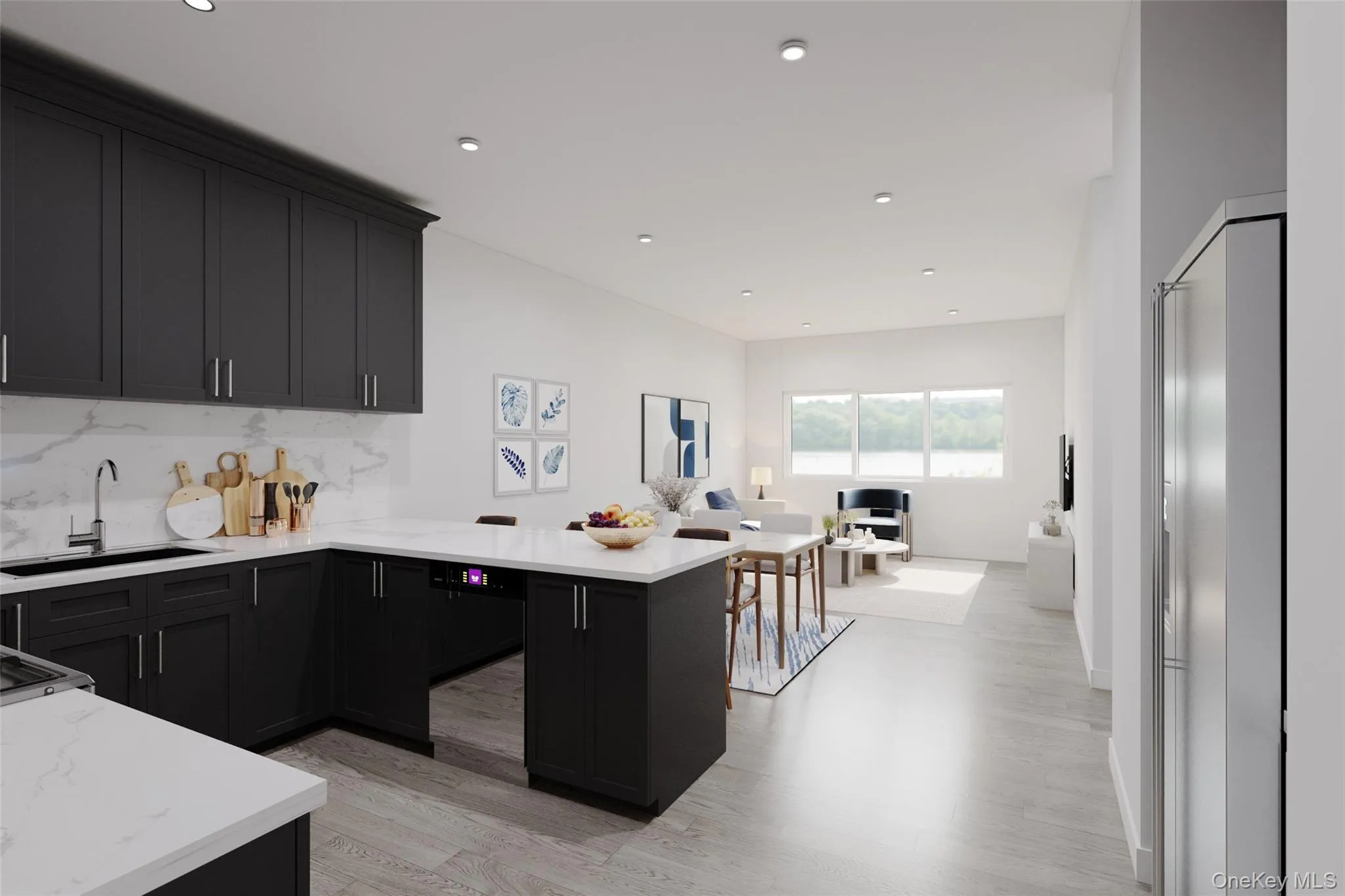 Kitchen featuring light stone countertops, light wood-style flooring, open floor plan, dark cabinetry, and recessed lighting Kitchen featuring light stone countertops, light wood-style flooring, open floor plan, dark cabinetry, and recessed lighting