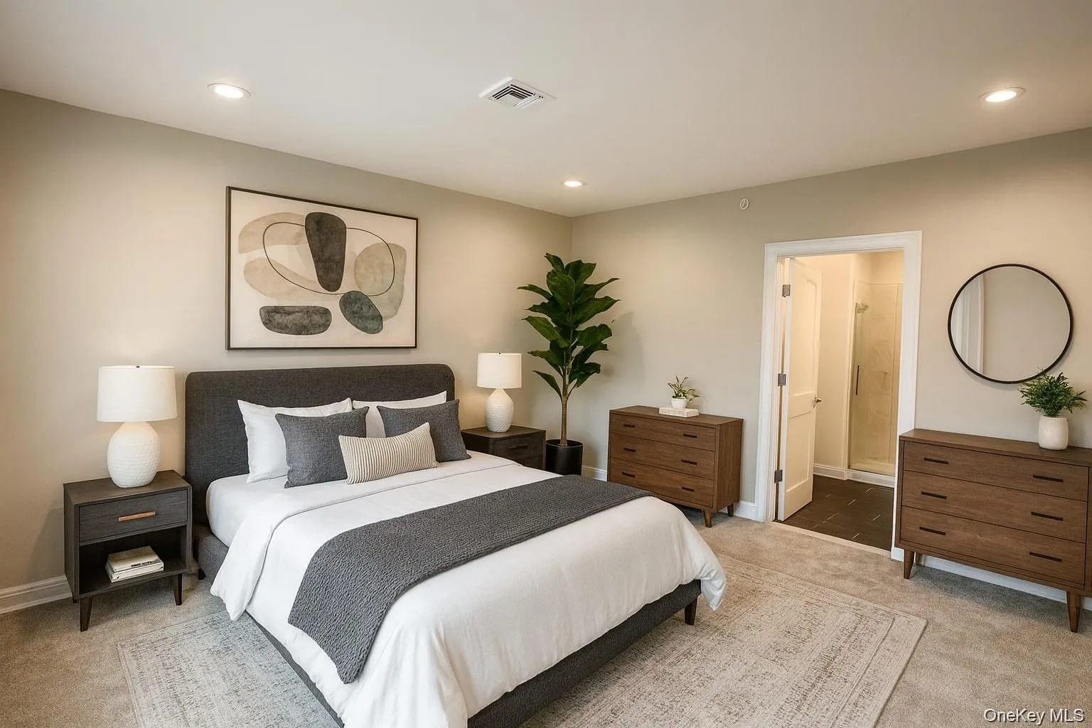 Bedroom featuring light colored carpet, recessed lighting, and ensuite bathroom Bedroom featuring light colored carpet, recessed lighting, and ensuite bathroom
