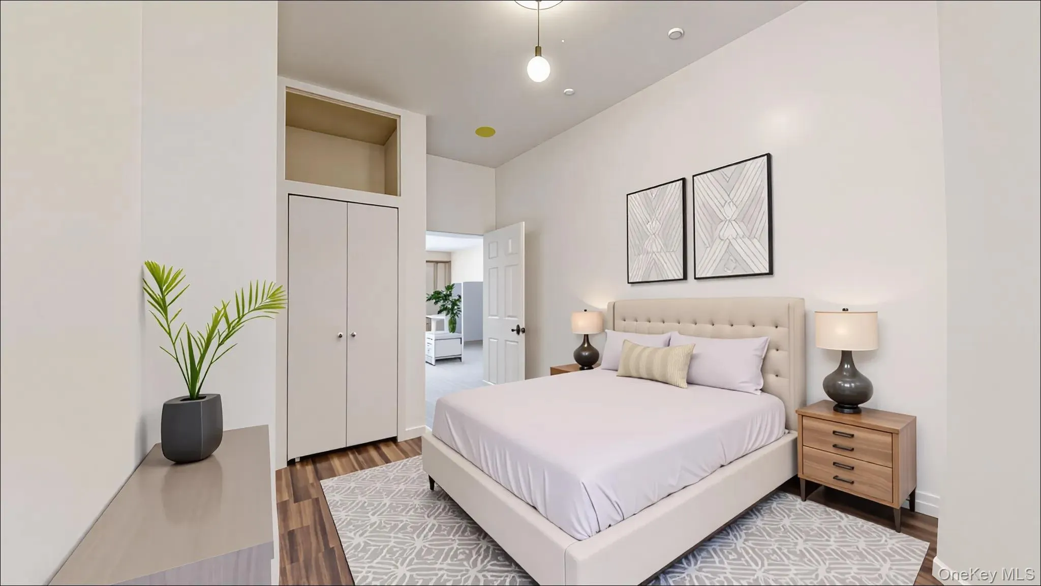Bedroom featuring dark wood-style floors and baseboards Bedroom featuring dark wood-style floors and baseboards