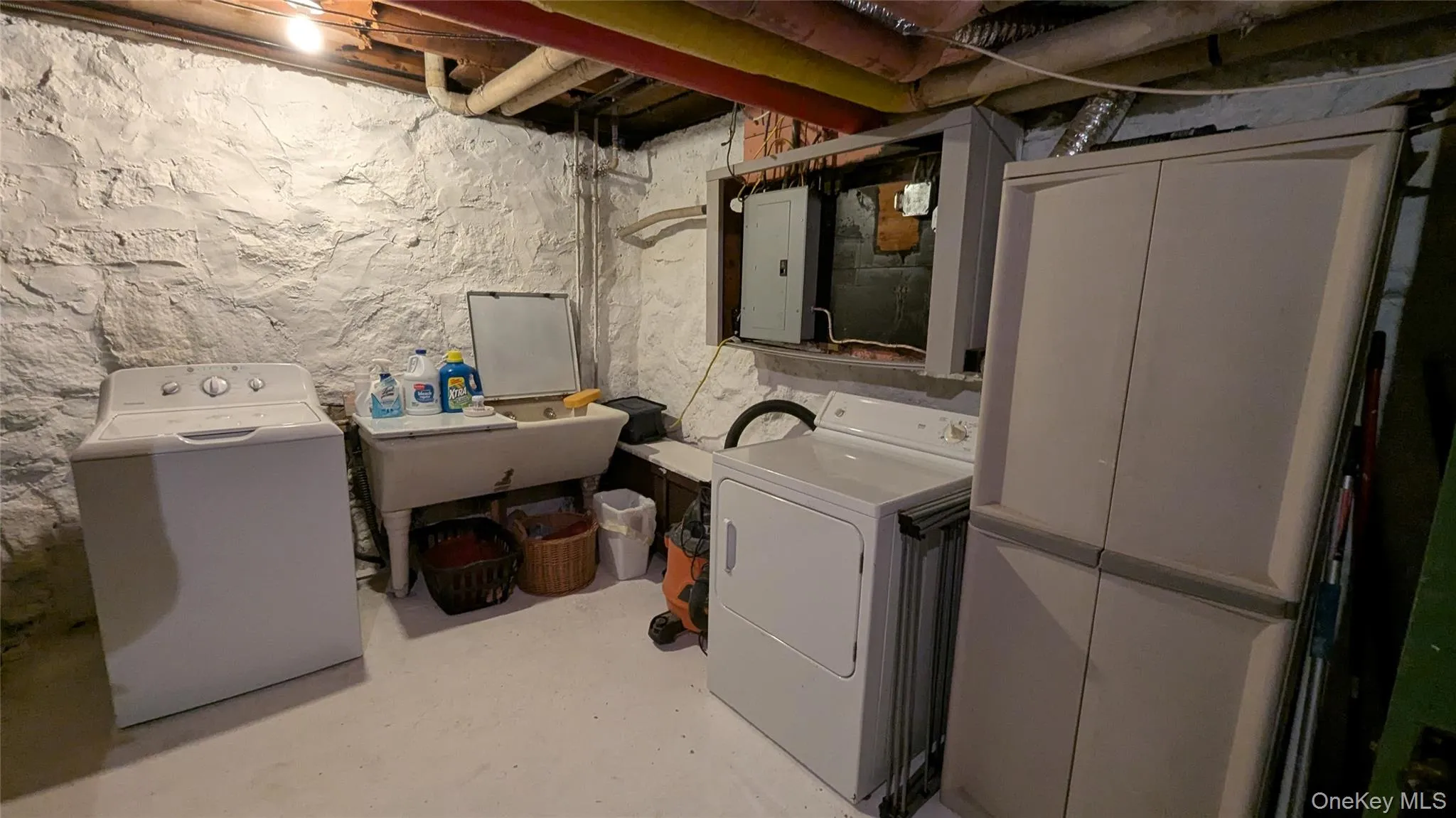 Washroom with separate washer and dryer and electric panel Washroom with separate washer and dryer and electric panel