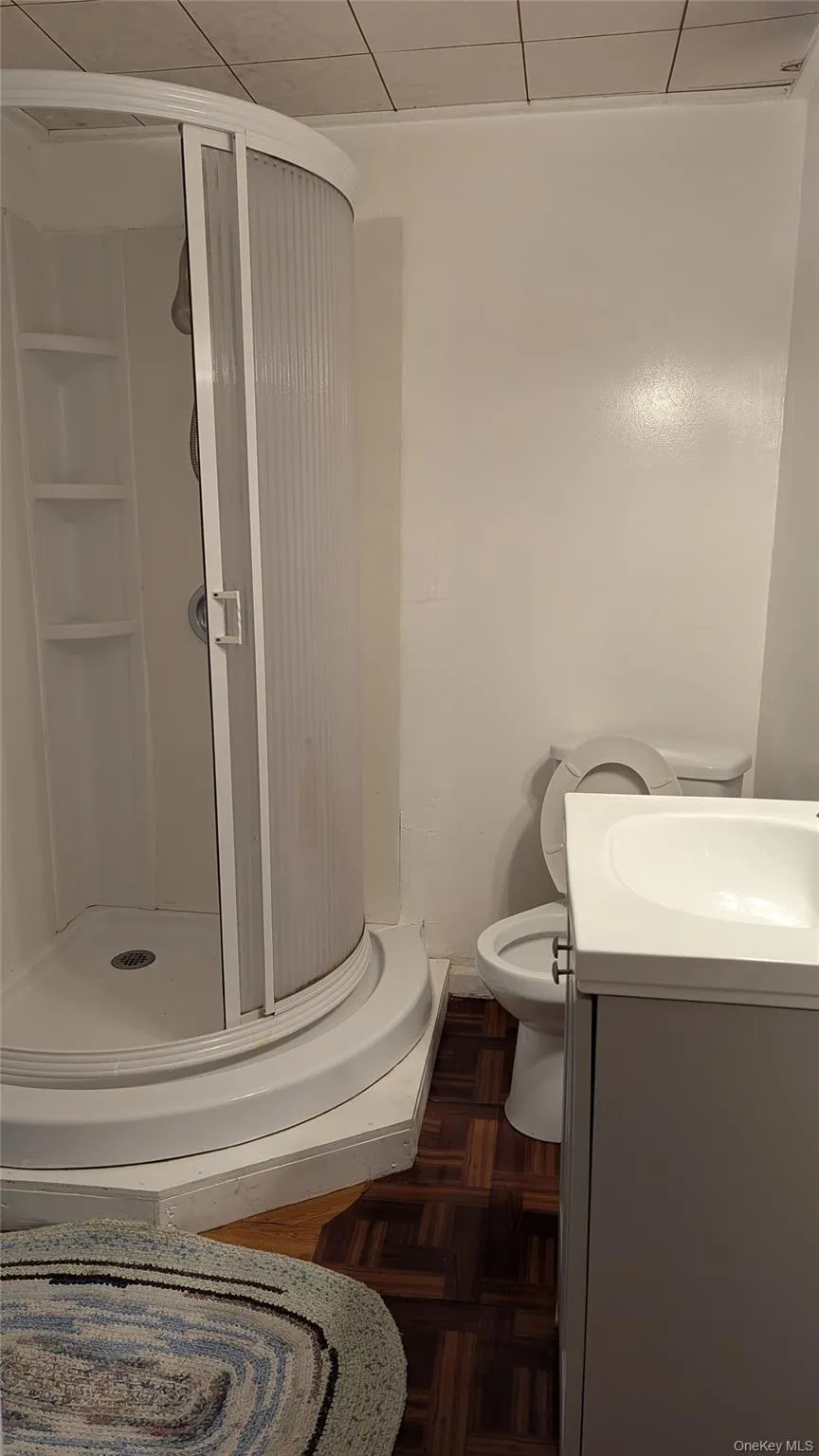 Full bath with vanity and a shower stall Full bath with vanity and a shower stall