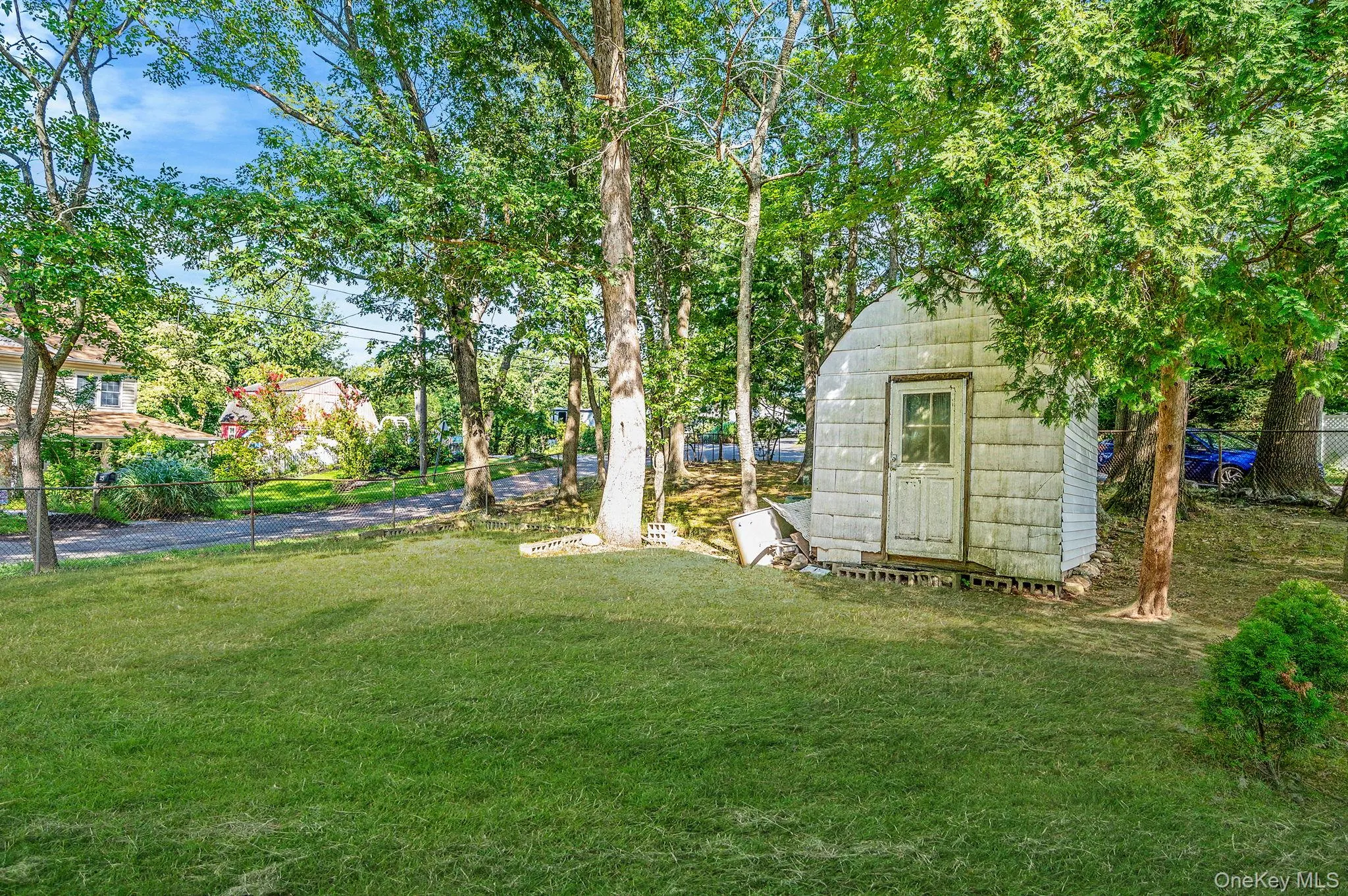 View of yard featuring a storage unit View of yard featuring a storage unit