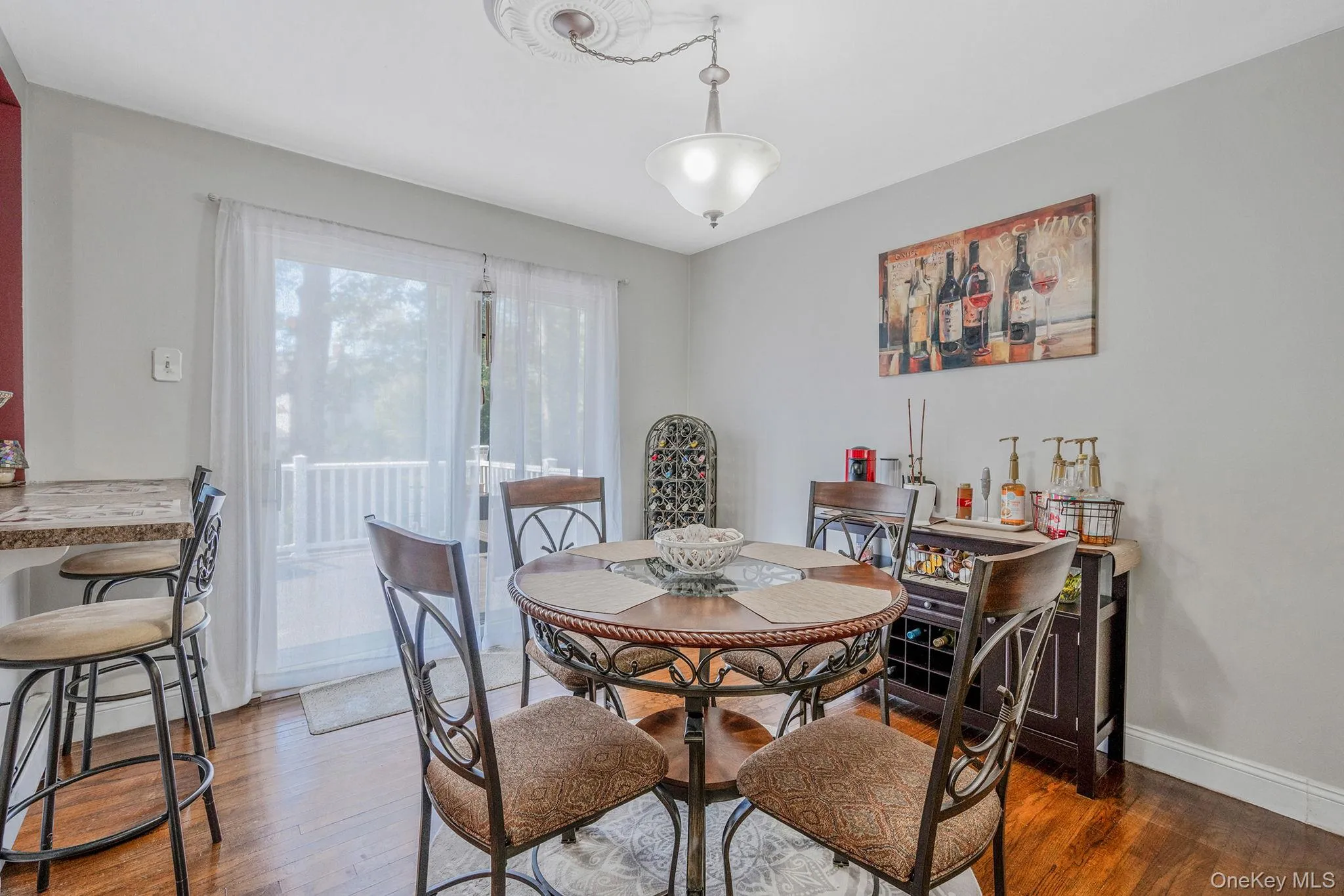 Dining space featuring wood finished floors Dining space featuring wood finished floors