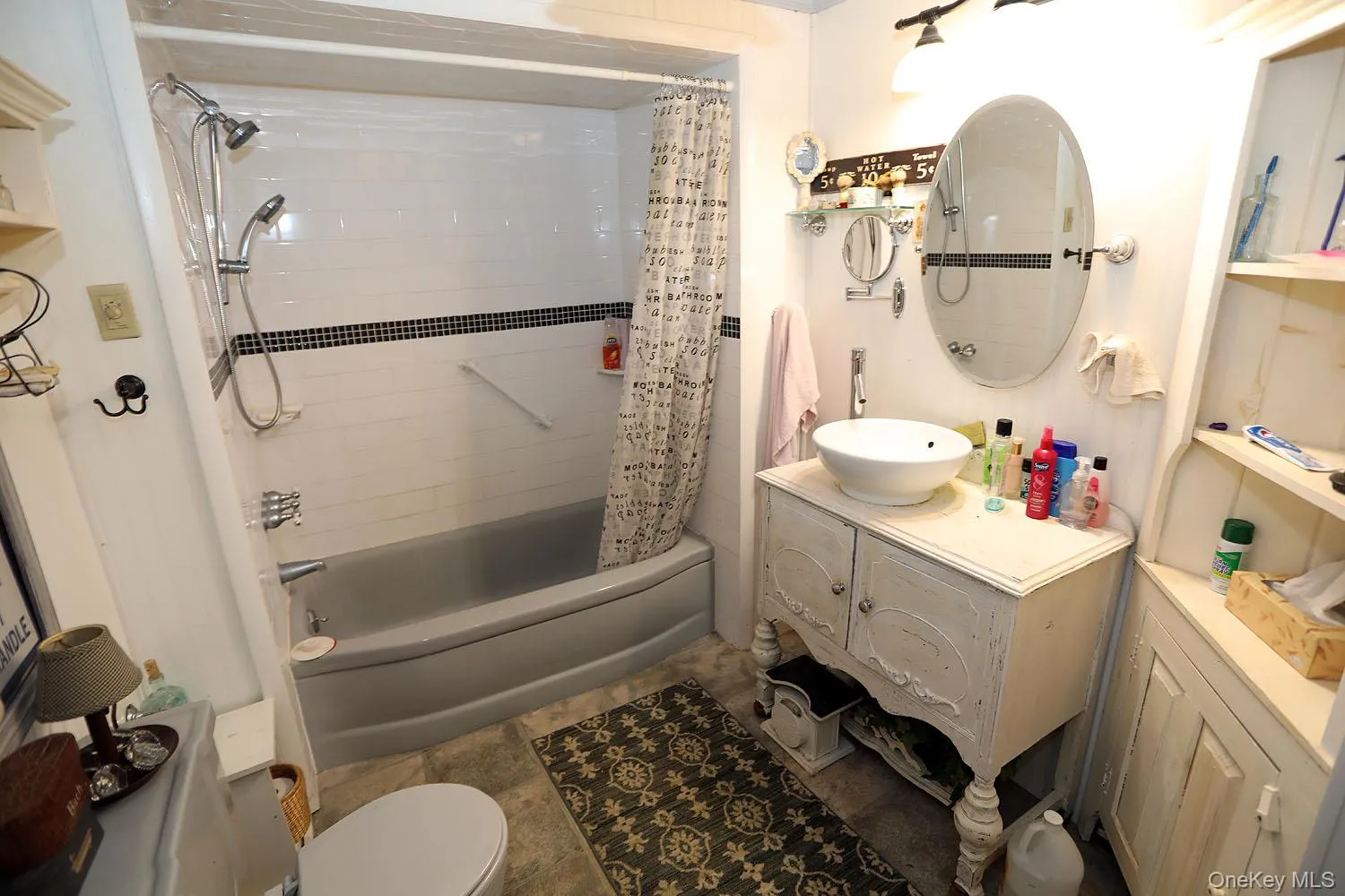 Full bathroom with shower / bath combo with shower curtain and vanity Full bathroom with shower / bath combo with shower curtain and vanity