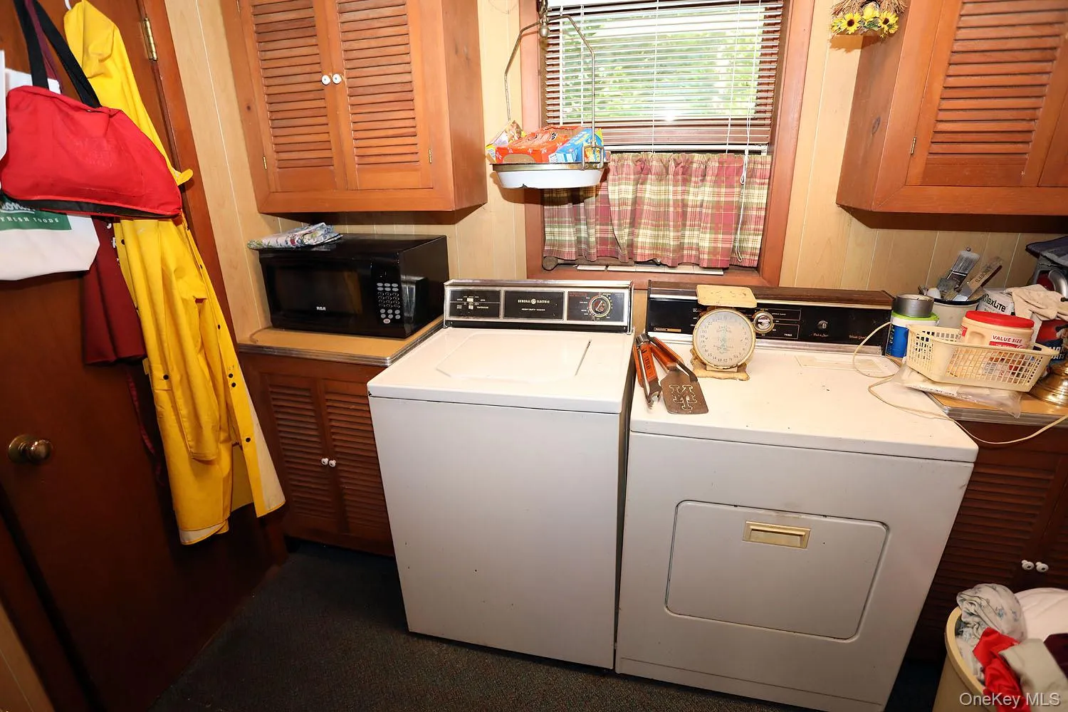 Laundry area featuring washer and clothes dryer and cabinet space Laundry area featuring washer and clothes dryer and cabinet space
