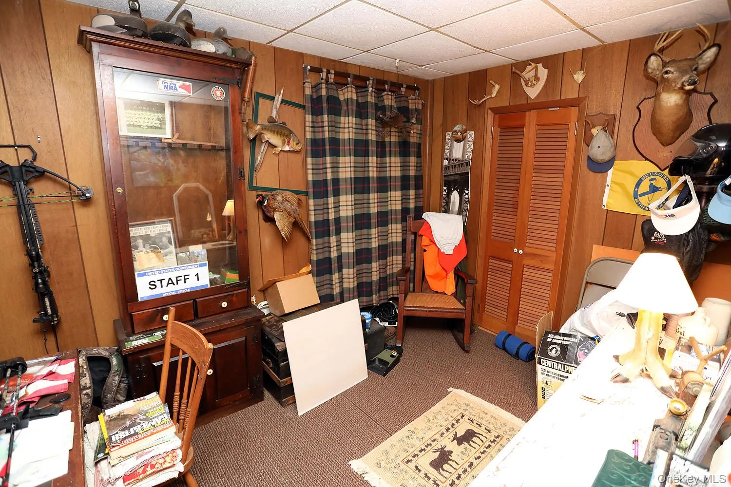 Bedroom used as Office space with wooden walls, a paneled ceiling, and carpet Bedroom used as Office space with wooden walls, a paneled ceiling, and carpet