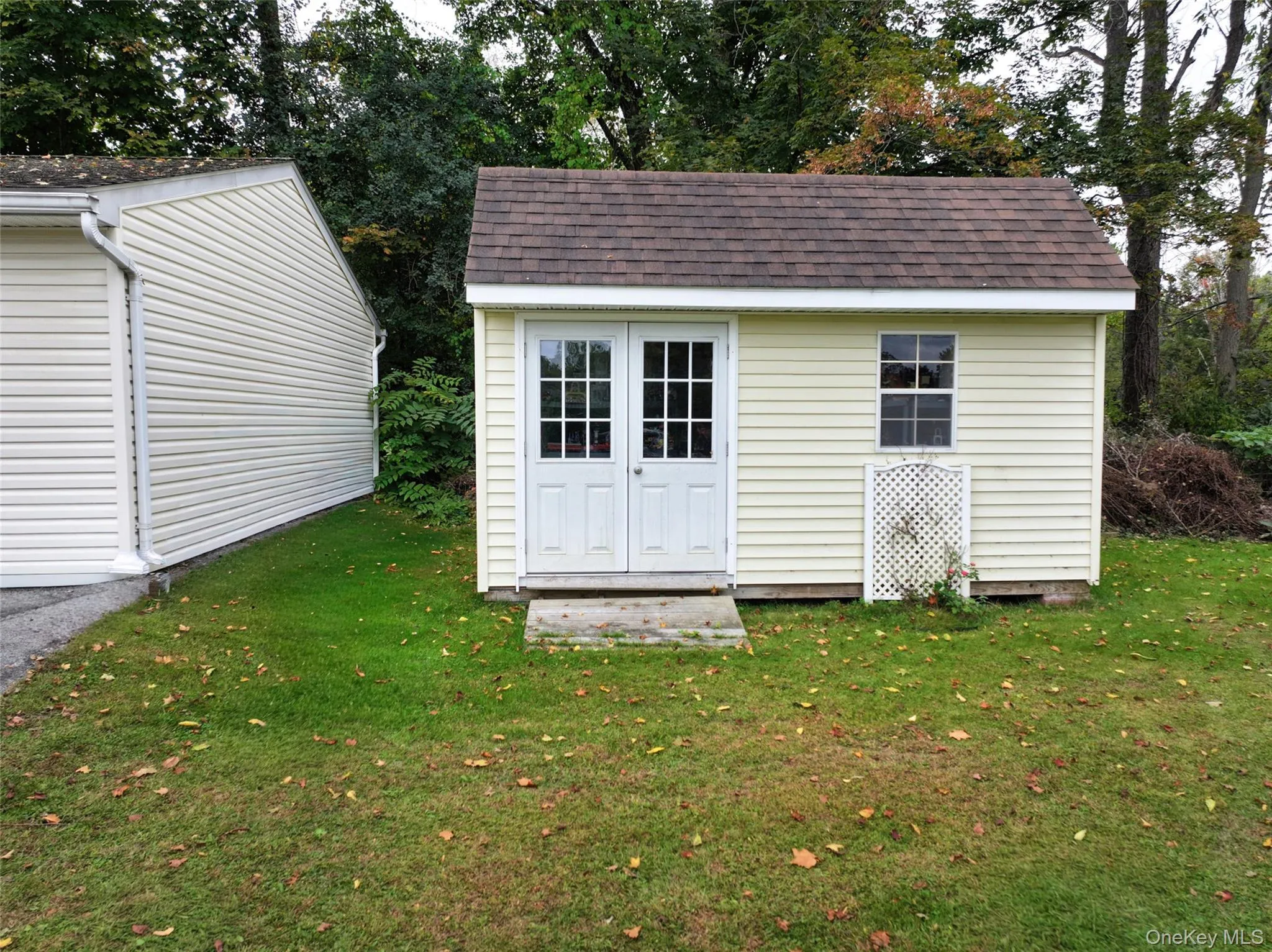 View of shed with double doors for easy storage. View of shed with double doors for easy storage.
