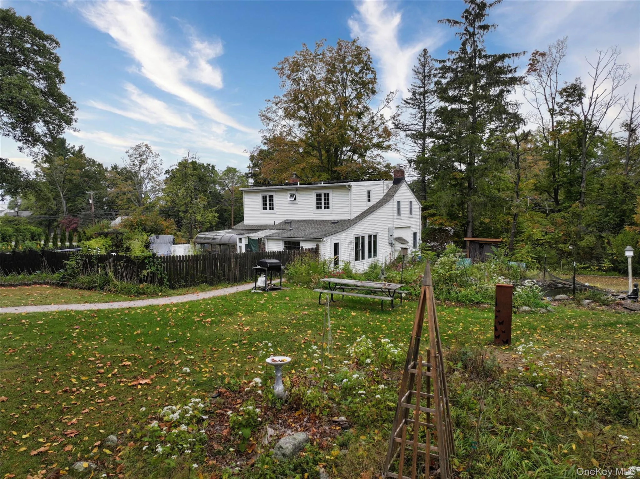Rear view of house with solar panels that are owned Rear view of house with solar panels that are owned