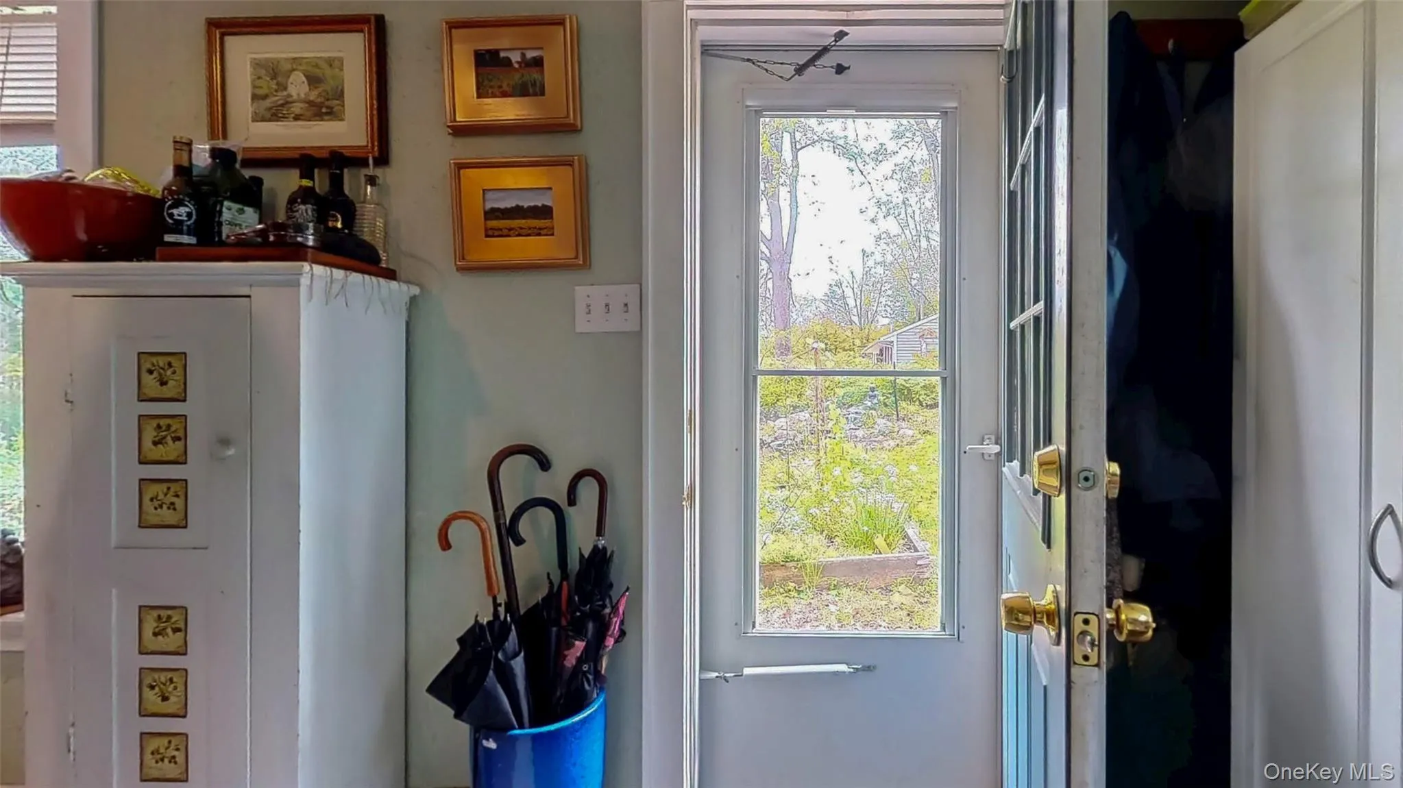 View of rear entryway from flower gardens and koi pond with waterfall View of rear entryway from flower gardens and koi pond with waterfall