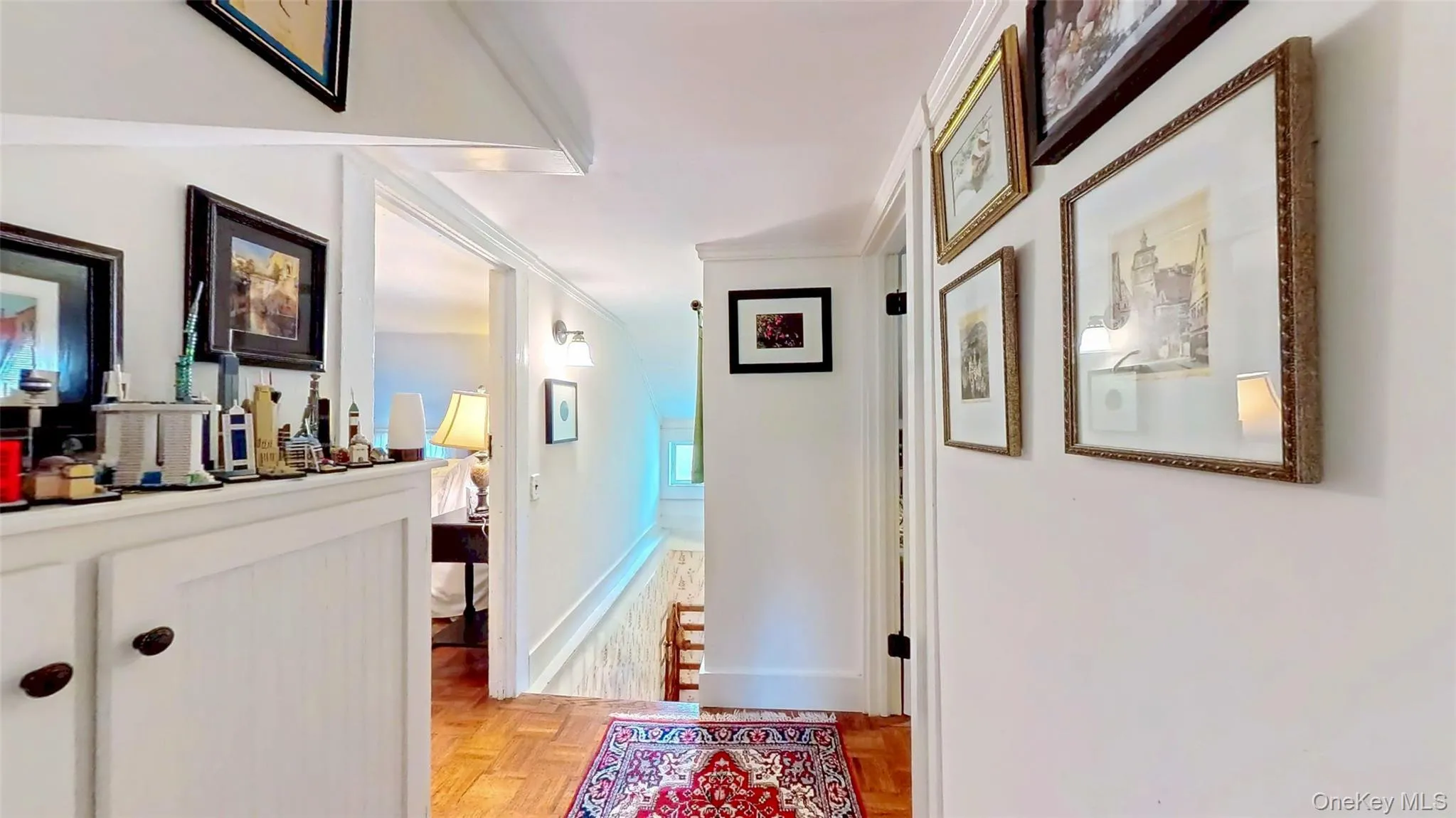 Hallway featuring ornamental molding and baseboards Hallway featuring ornamental molding and baseboards