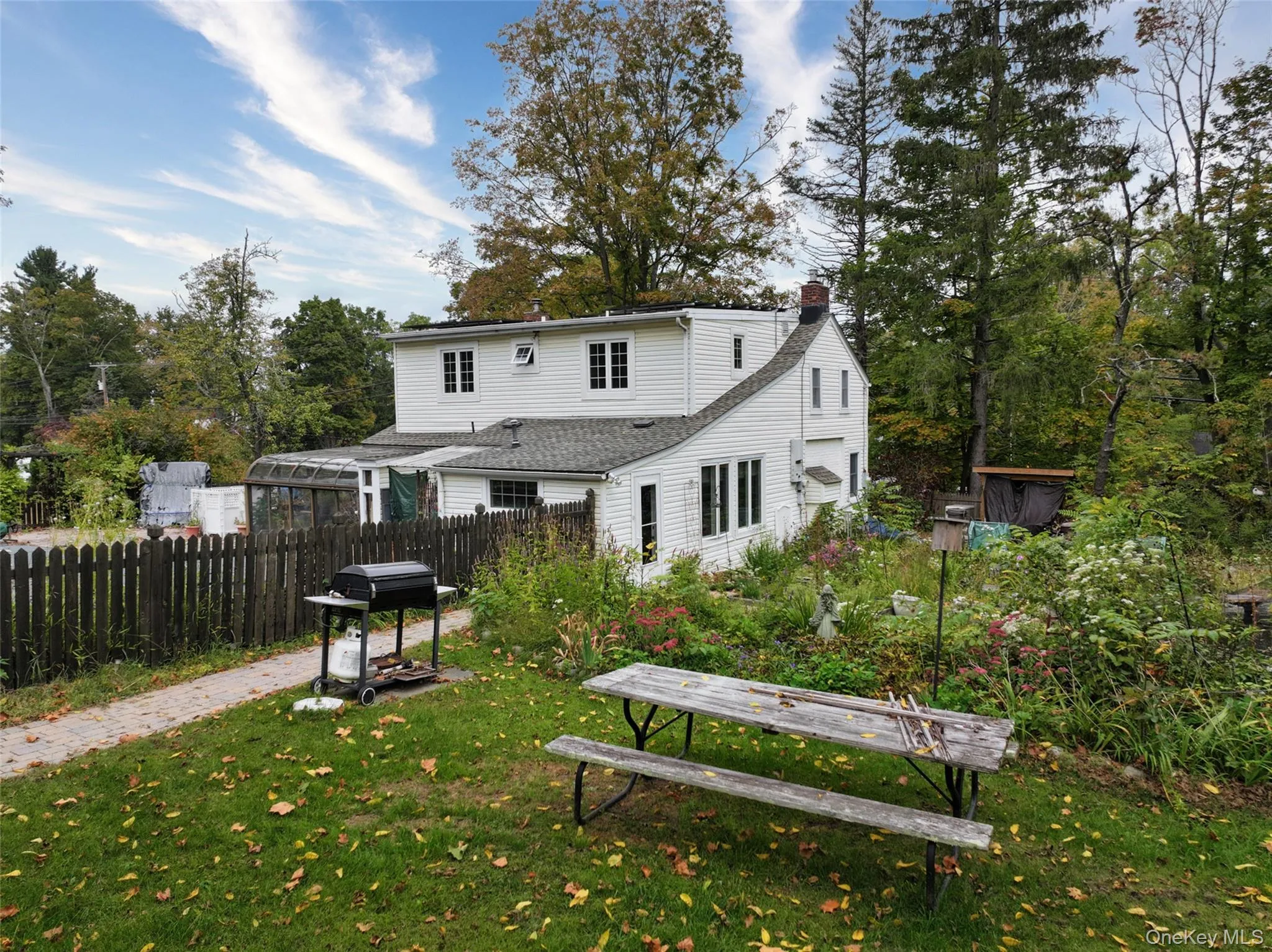 Rear view of property featuring a fenced inground pool. Rear view of property featuring a fenced inground pool.