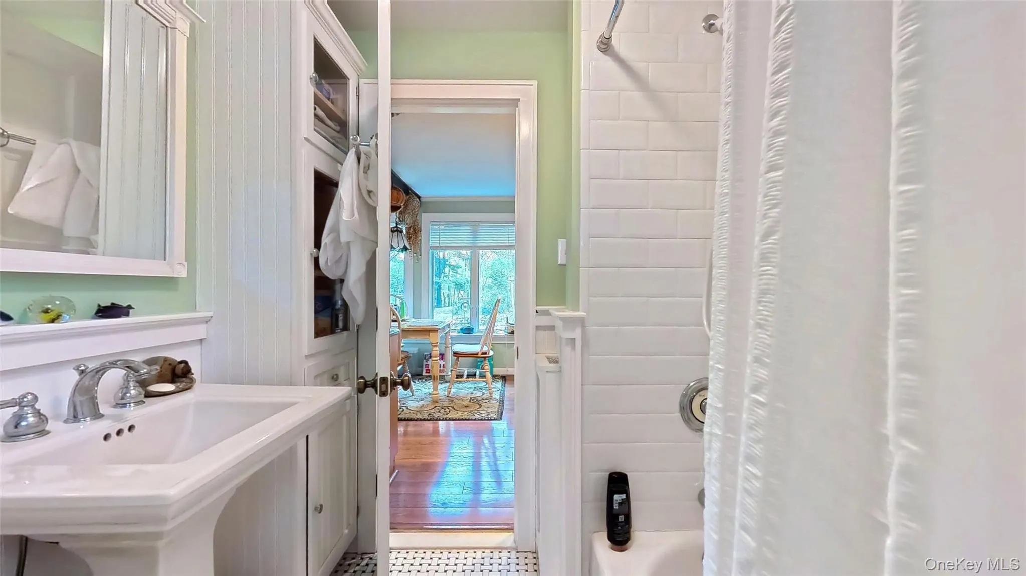 Bathroom with shower / tub combo and pedestal sink and storage Bathroom with shower / tub combo and pedestal sink and storage