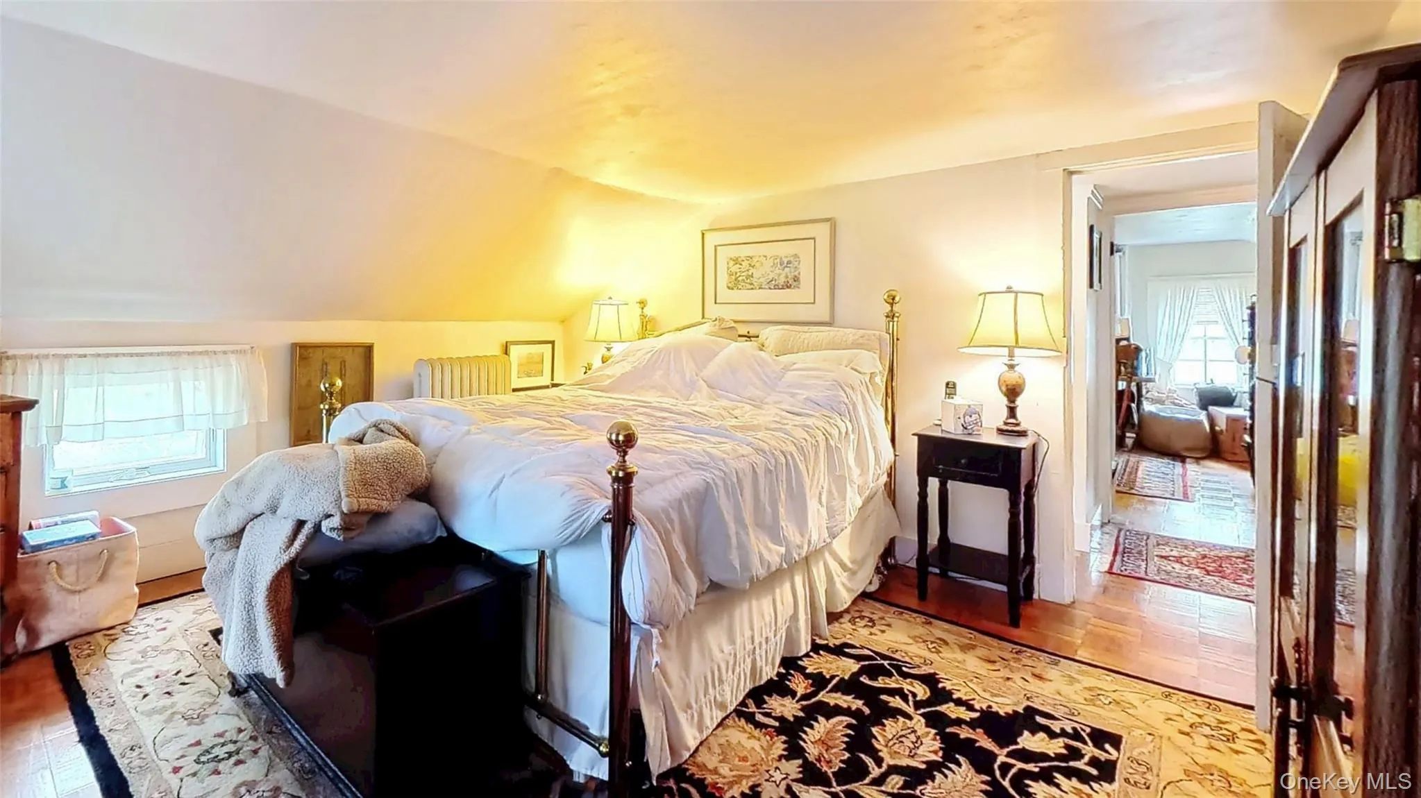 Bedroom with wood floors and custom low to floor window Bedroom with wood floors and custom low to floor window