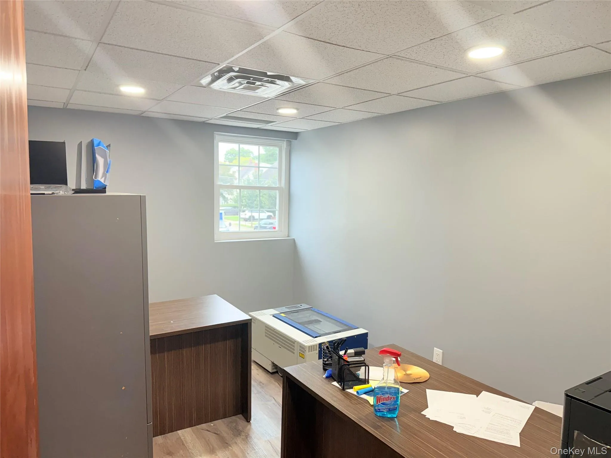 Office featuring a paneled ceiling, light wood-type flooring, and recessed lighting Office featuring a paneled ceiling, light wood-type flooring, and recessed lighting