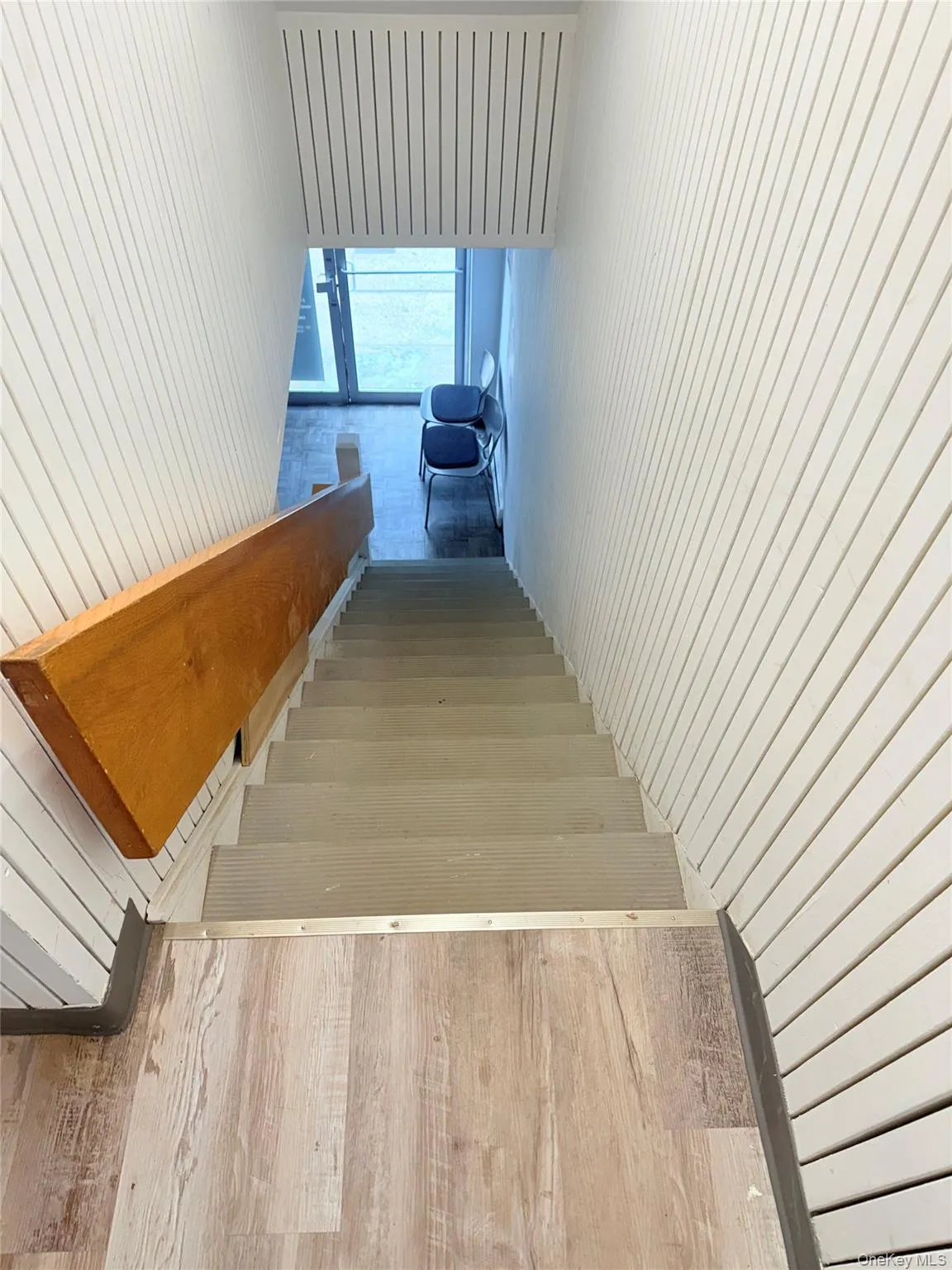 Staircase with wood walls and wood finished floors Staircase with wood walls and wood finished floors