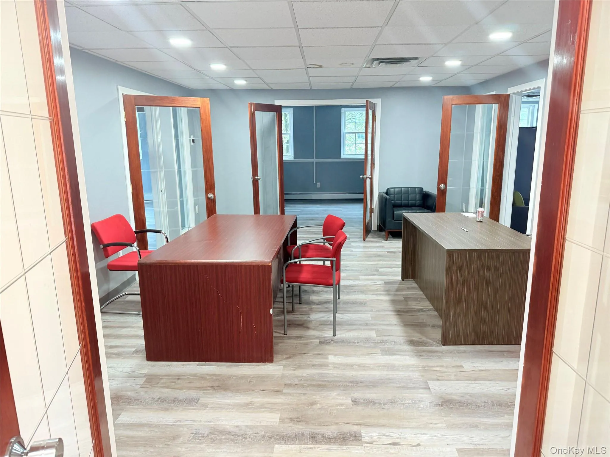 Welcome area with a drop ceiling and recessed lighting Welcome area with a drop ceiling and recessed lighting