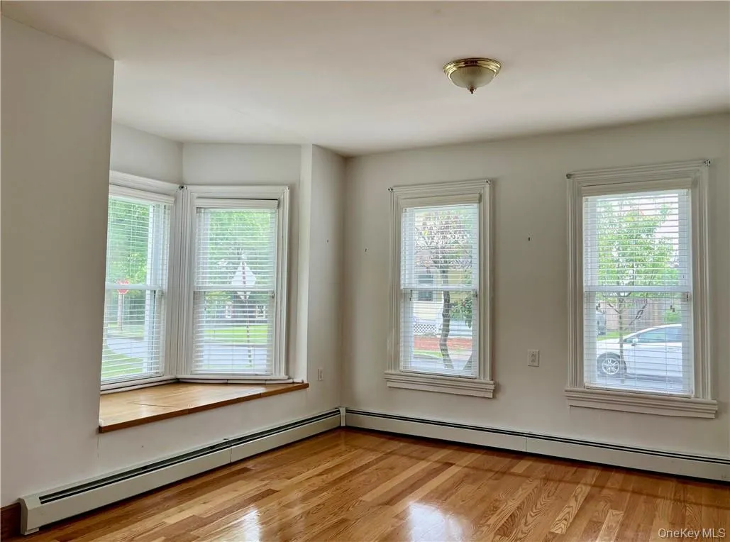 Notice the gleaming wood floors and window seat Notice the gleaming wood floors and window seat