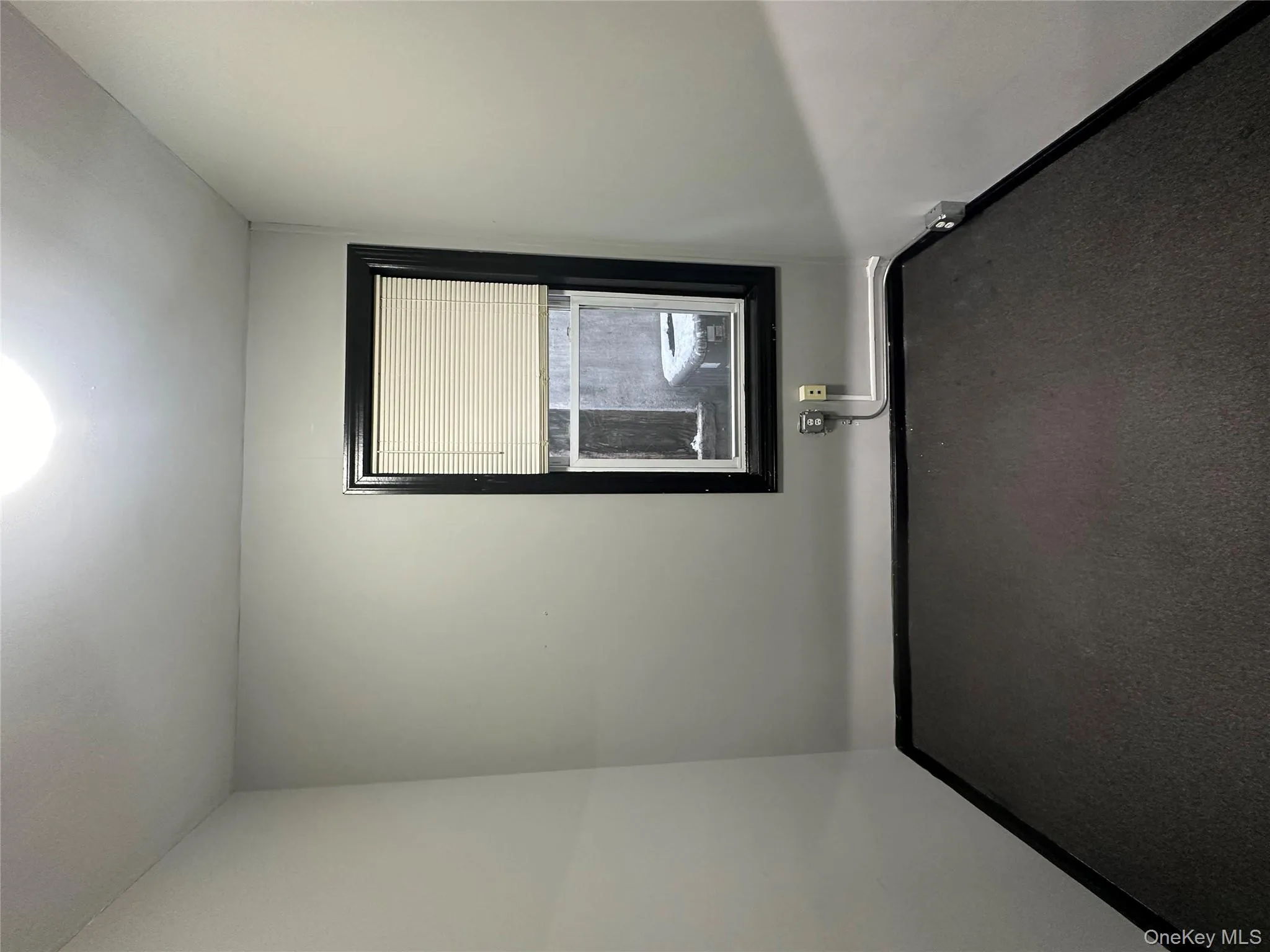 Empty room featuring carpet flooring and baseboards Empty room featuring carpet flooring and baseboards