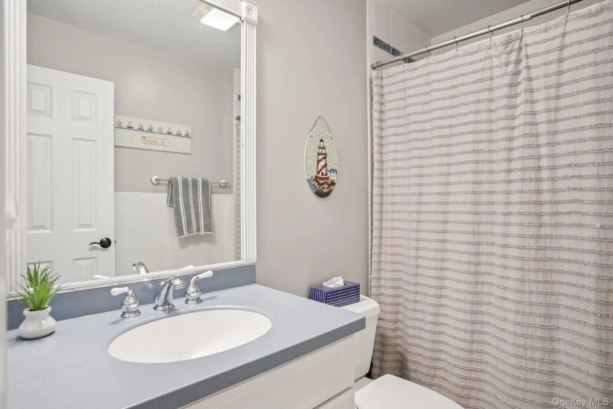 Bathroom featuring vanity and toilet Bathroom featuring vanity and toilet