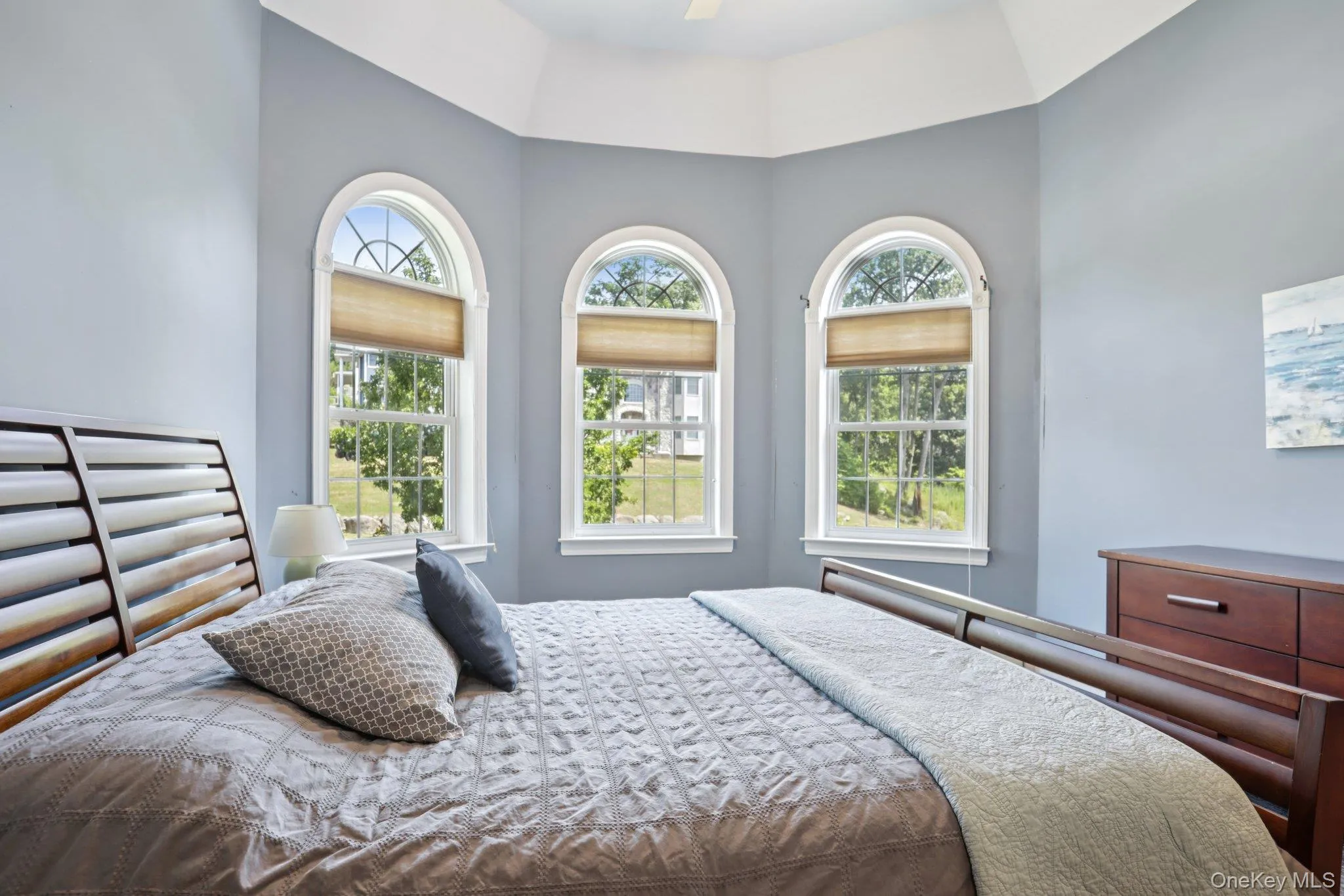 Bedroom with multiple windows and ceiling fan Bedroom with multiple windows and ceiling fan
