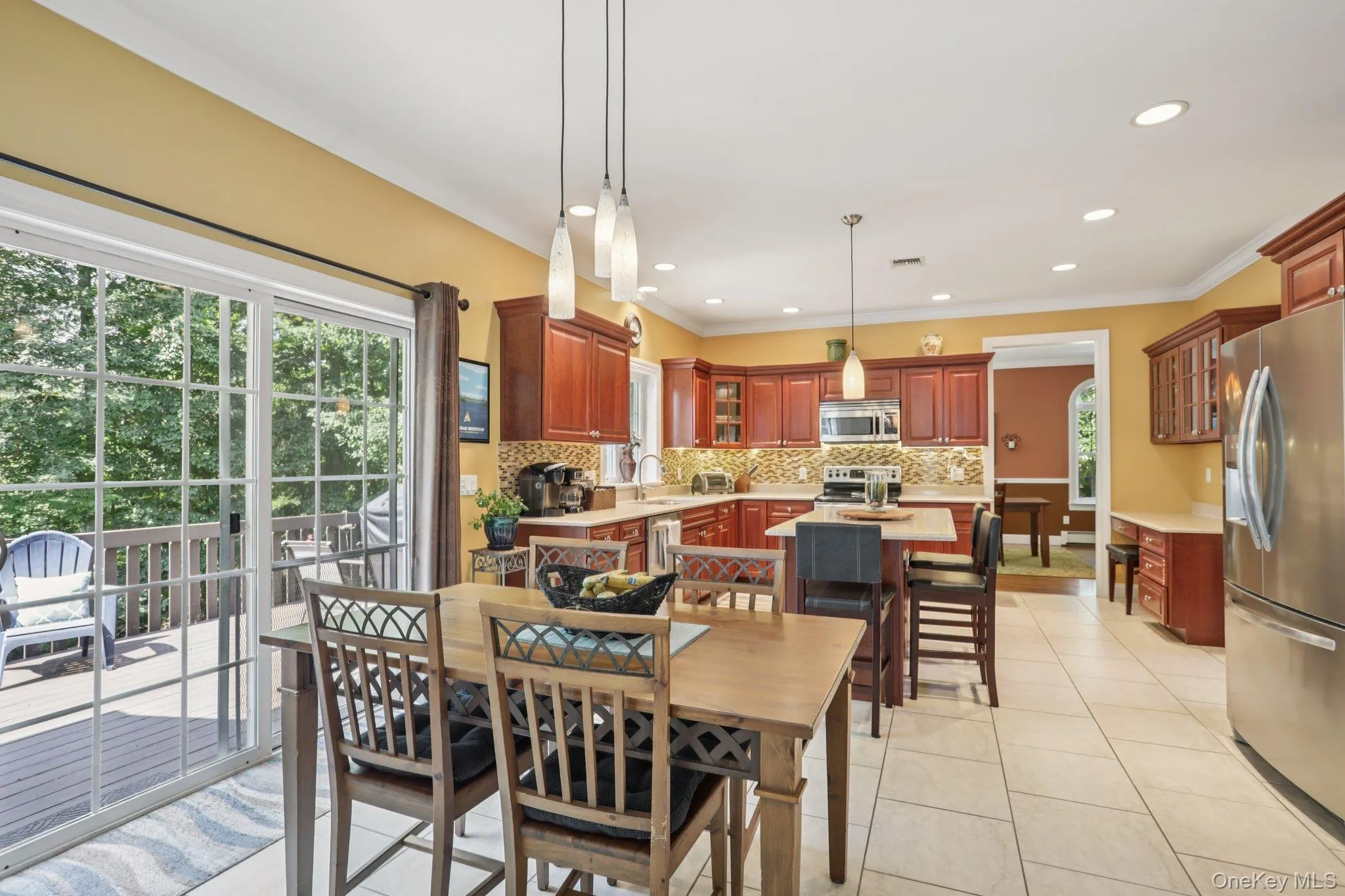 Dining area with light tile patterned floors, recessed lighting, and crown molding Dining area with light tile patterned floors, recessed lighting, and crown molding