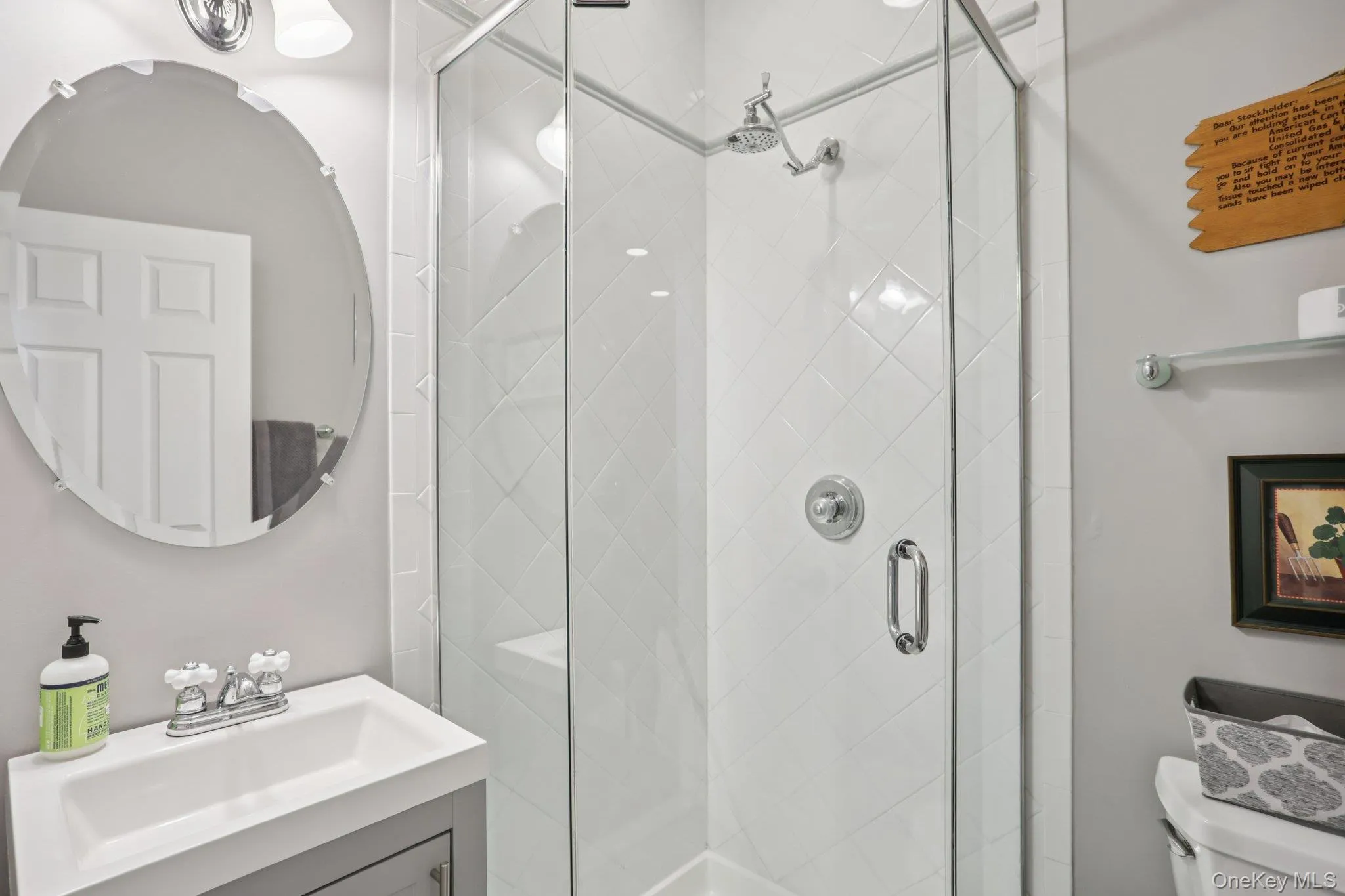 Bathroom with vanity and a stall shower Bathroom with vanity and a stall shower