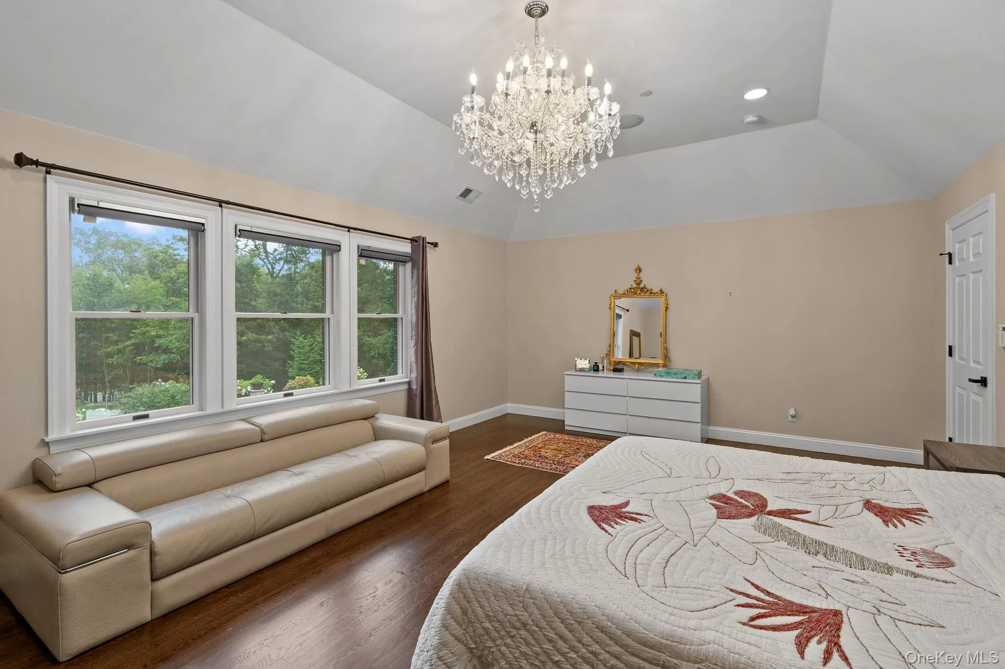 Bedroom featuring a chandelier, dark wood-type flooring, lofted ceiling, and recessed lighting Bedroom featuring a chandelier, dark wood-type flooring, lofted ceiling, and recessed lighting