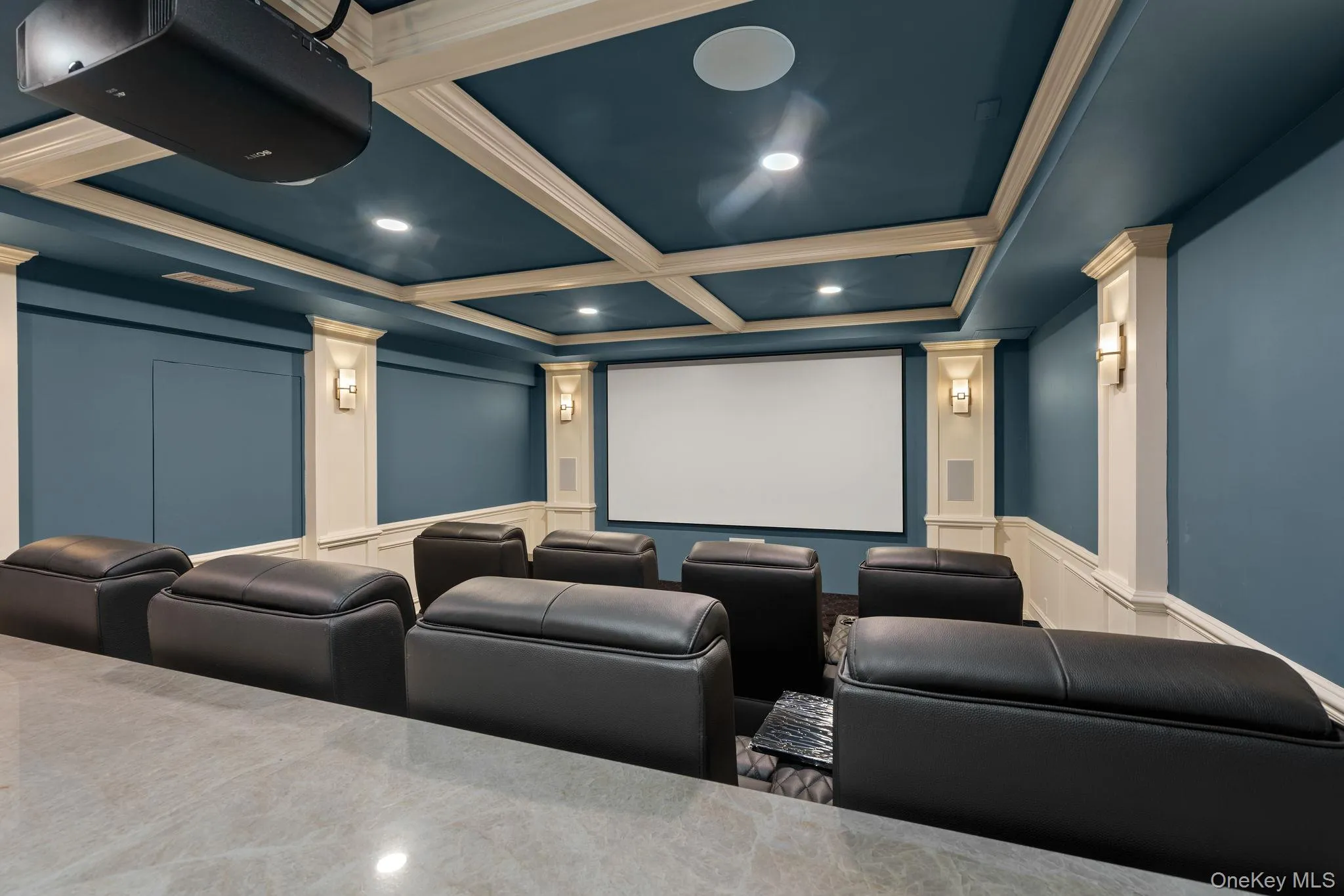 Cinema featuring crown molding, a decorative wall, recessed lighting, and beamed ceiling Cinema featuring crown molding, a decorative wall, recessed lighting, and beamed ceiling