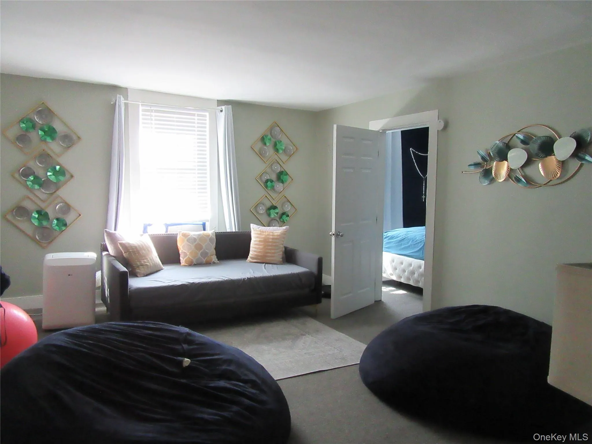 Living room featuring carpet floors and baseboards Living room featuring carpet floors and baseboards