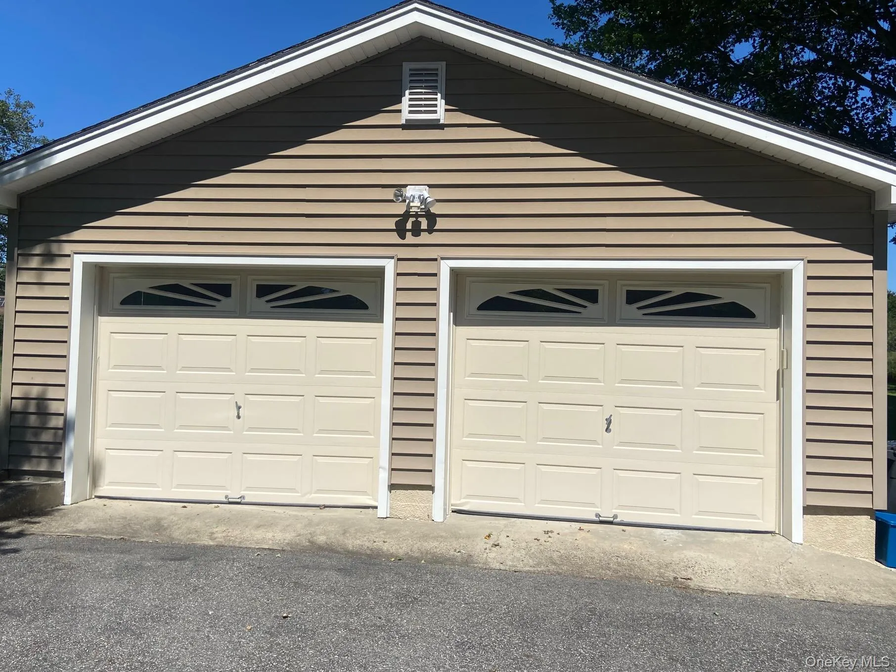 Detached garage with asphalt driveway Detached garage with asphalt driveway