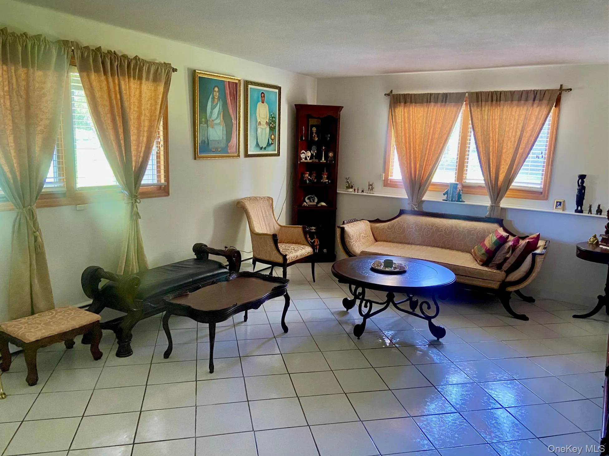 Sitting room featuring light tile patterned floors Sitting room featuring light tile patterned floors