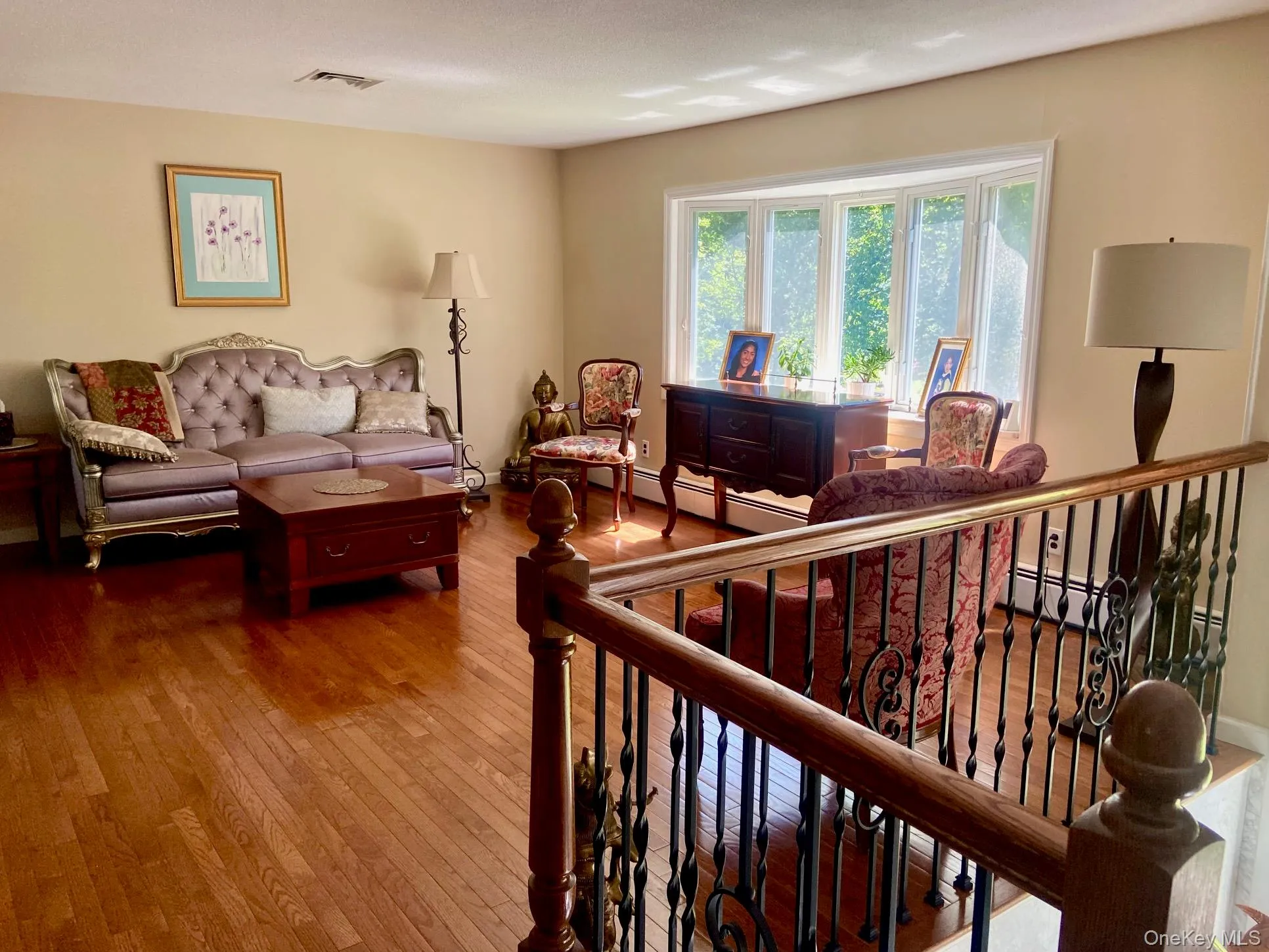 Living area with hardwood floors Living area with hardwood floors