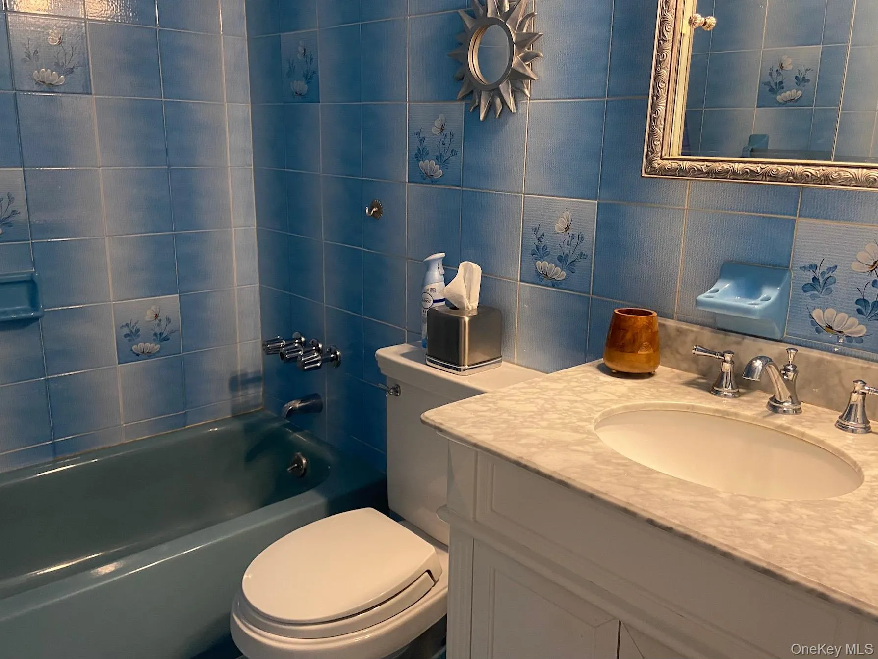 Full bath with tile walls, tub / shower combination, vanity, and tasteful backsplash Full bath with tile walls, tub / shower combination, vanity, and tasteful backsplash