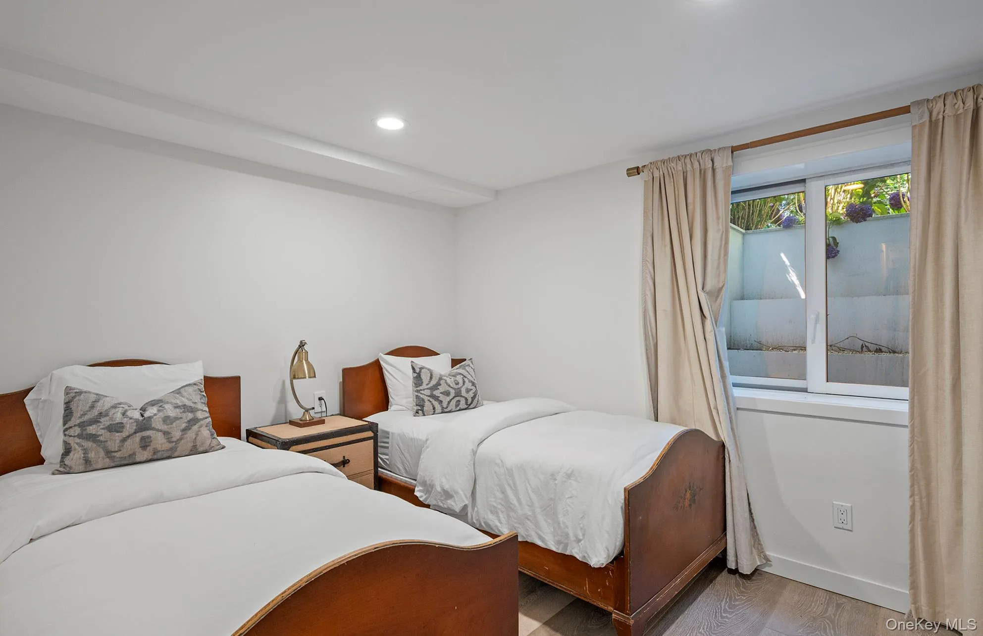 Bedroom featuring wood finished floors and recessed lighting Bedroom featuring wood finished floors and recessed lighting