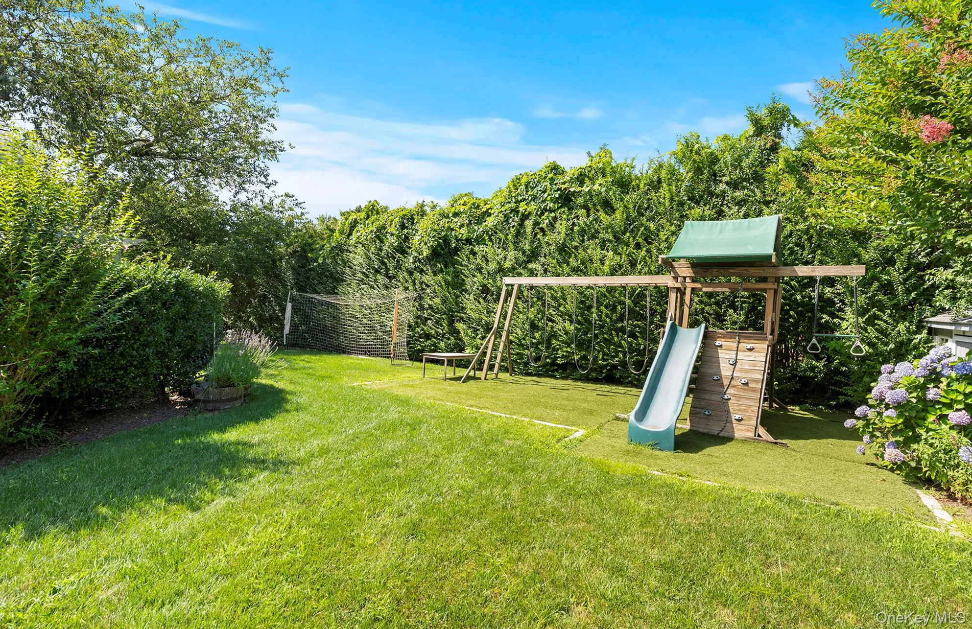 View of grassy yard with a playground View of grassy yard with a playground