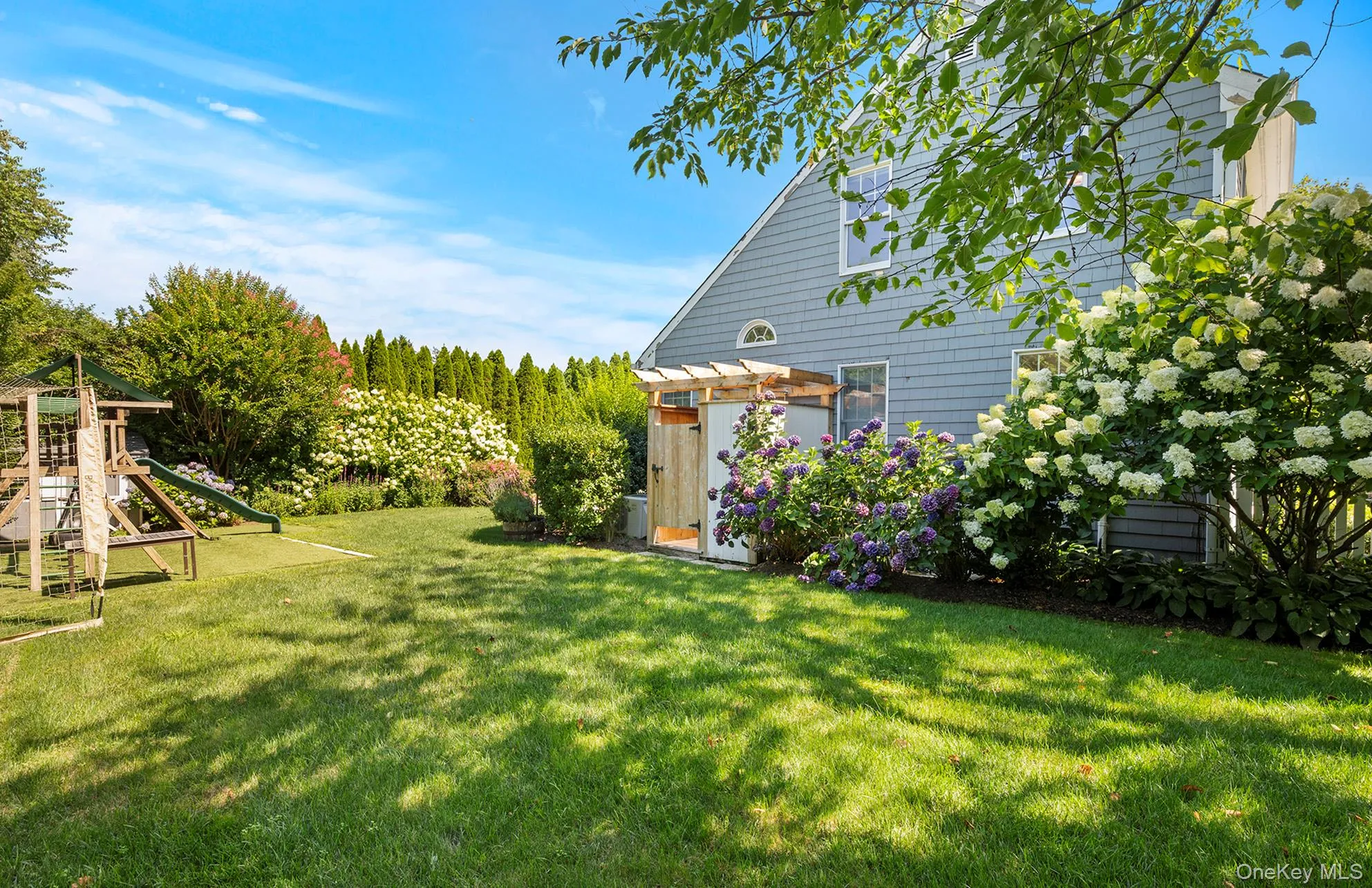 View of grassy yard featuring a playground View of grassy yard featuring a playground