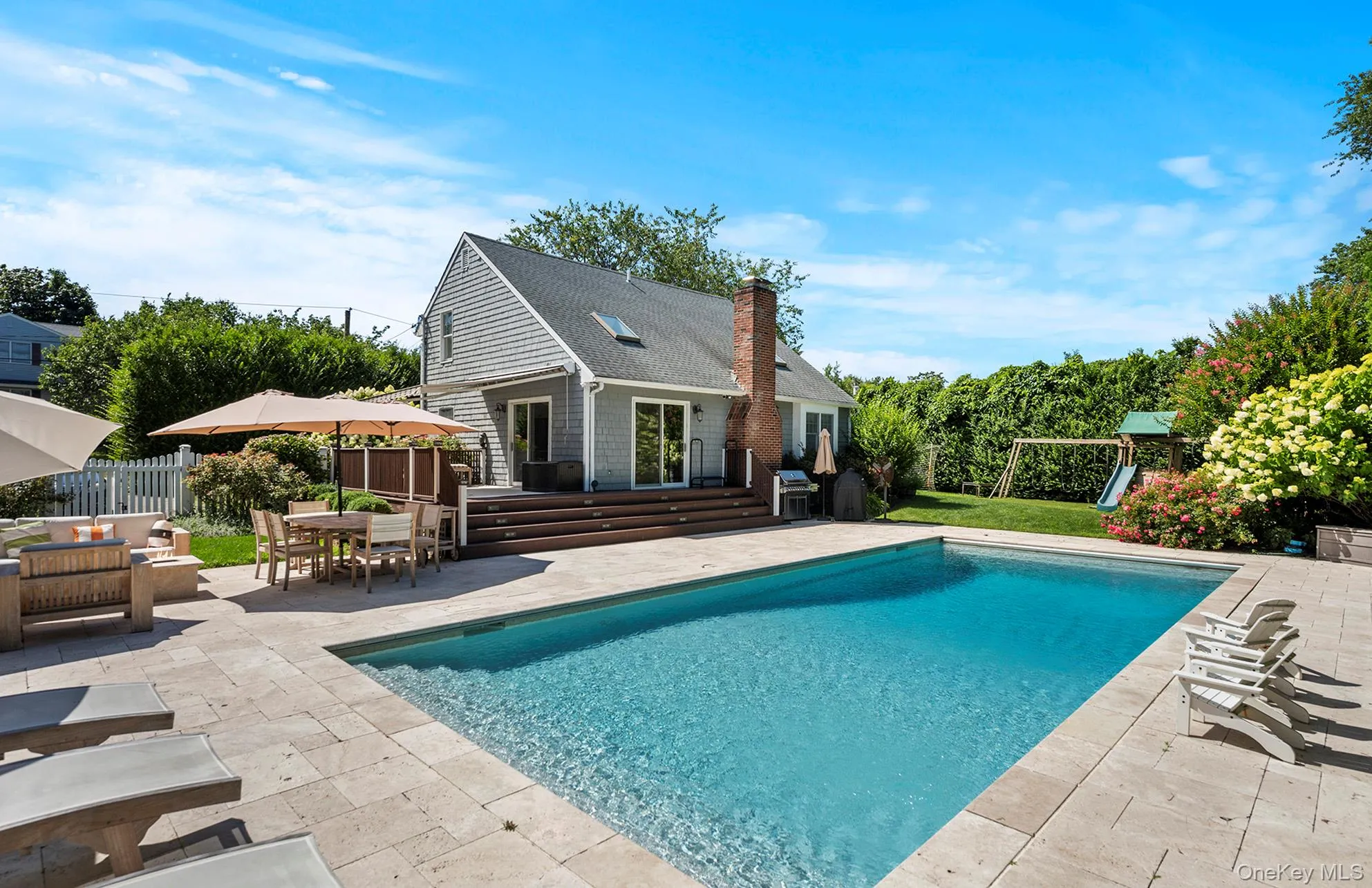 Swimming pool featuring a patio area, area for grilling, and outdoor dining space Swimming pool featuring a patio area, area for grilling, and outdoor dining space