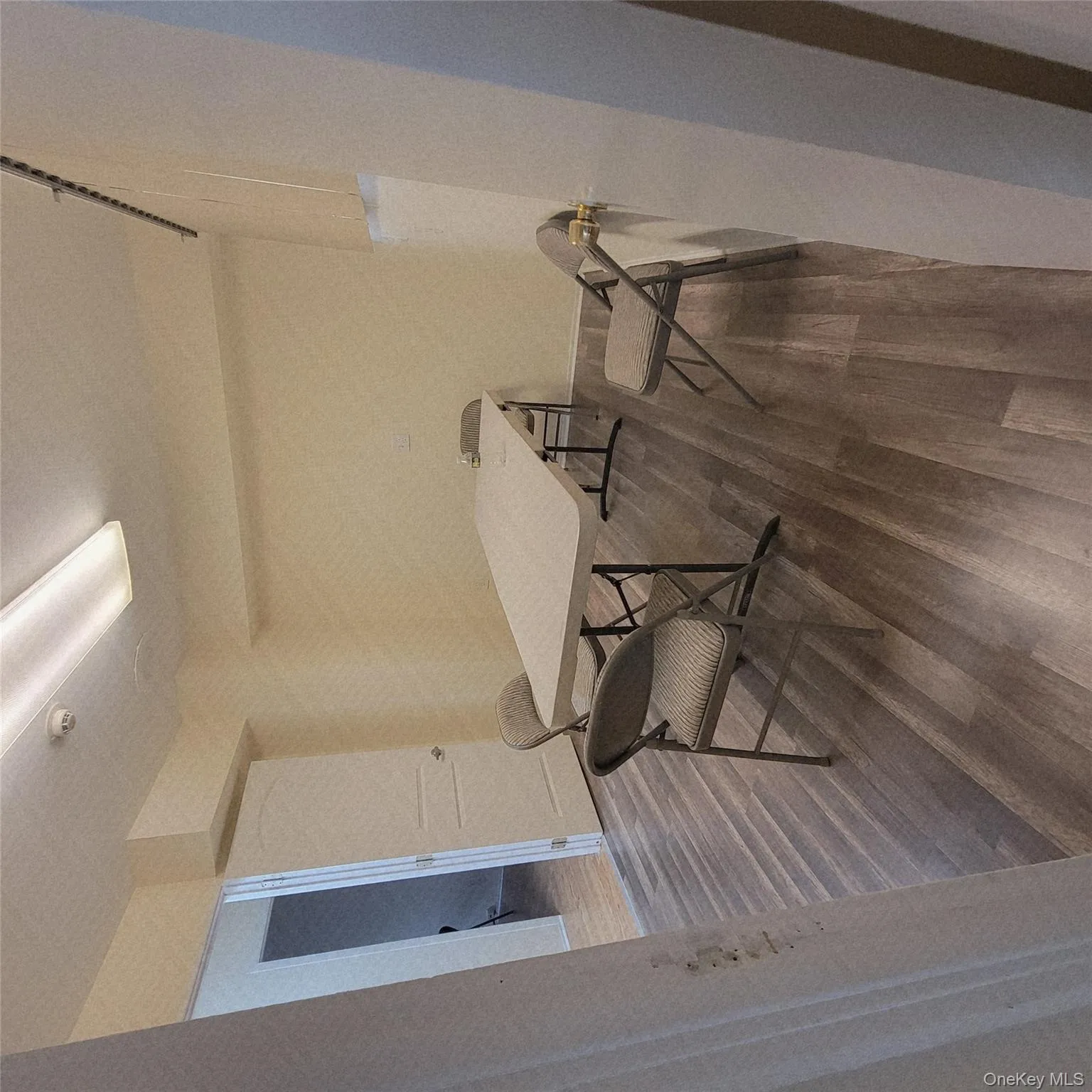 Dining area with dark wood-style floors Dining area with dark wood-style floors
