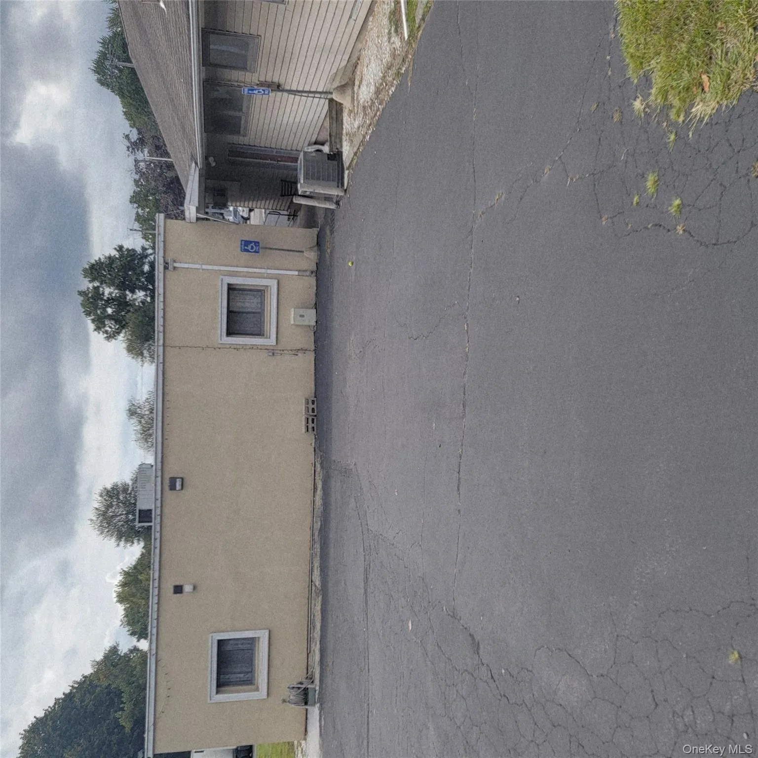 View of property exterior with stucco siding and a central AC unit View of property exterior with stucco siding and a central AC unit
