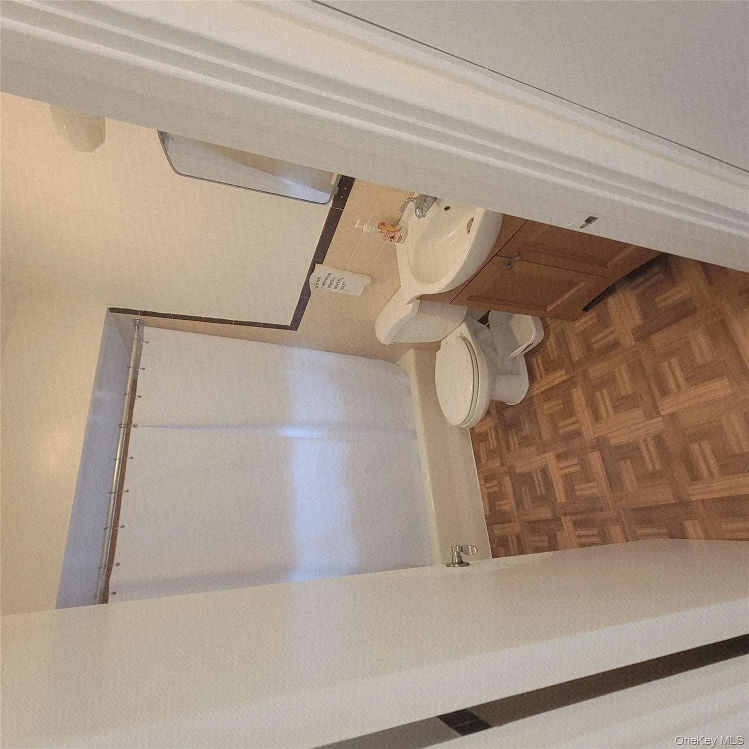 Bathroom with tile walls, vanity, and shower / tub combination Bathroom with tile walls, vanity, and shower / tub combination